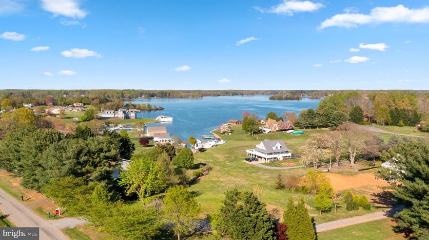 AMAZING WATERFRONT LOT on LAKE ANNA! Come enjoy being on the water and having fun at the lake while you build your dream house. Dock your boat in your very own boathouse that has a lift, storage shed and huge sunning deck! There is also another deck with a sandy beach where you relax and enjoy a beverage or walk right into the water for a swim. This is also a great place to put your kayaks in! Located in one of the best cove neighborhoods on the public side of the lake with fantastic waterfront views. Take a boat ride to restaurants & have access to gas right on the water! Don't miss out on building on this once in a lifetime lot! The property already has a well and septic system in place and ready to go!