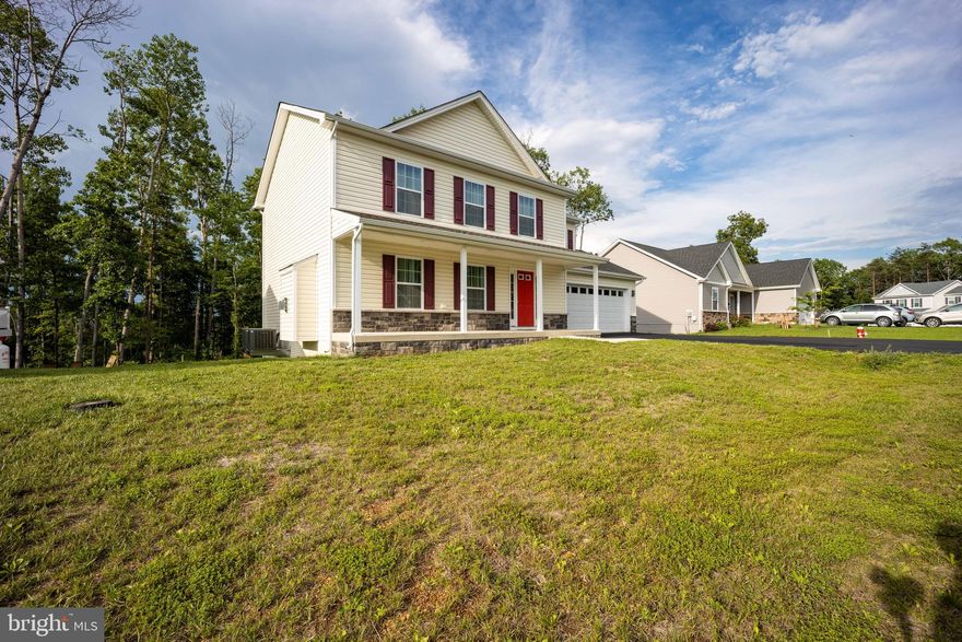 Like New!  Home barely lived in. Great family home situated in a well established family friendly neighborhood. Great commuter location and convenient to schools & shopping. Custom paint throughout. 
Kitchen has granite countertops and is open to family room. Laminate flooring in  Great room, Living Room and Kitchen.  Living room features a gas fireplace with mantel.  10 X 12 newly stained deck accessible from the kitchen for easy grilling or enjoying your morning coffee.   This home features 3 large bedrooms and primary suite with tray ceilings on the upper level. Primary bath has soaking tub and tiled shower and flooring. Walk in closet.  Laundry room on bedroom level also with tiled flooring.  Walk out basement with rough in plumbing for future 3rd bath. Two car garage, insulated, drywalled, insulated garage door and opener.