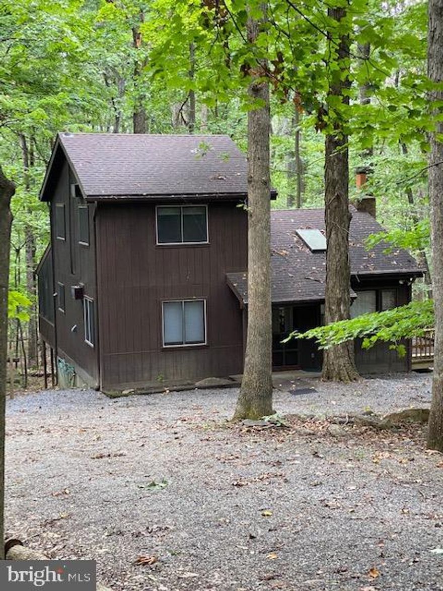 Chalet style home located in the quiet neighborhood of Coolfont Mountainside.  Sellers loved this house for 33 years.  It's their "WV Fling".  But now it's time to sell.  The first floor offers an open floor plan with a living room that boasts a brick fireplace with a wood burning insert.  The skylights let the sunshine in.  Pella, sliding glass doors lead from the dining room area to the wrap around deck.  The kitchen has patio doors that lead to the screened in porch.  You'll want to bring your coffee and book to read while enjoying the view.  Offering 3 bedrooms, one on the main level and two upstairs with 2 full bathrooms.  The community offers swimming pool, tennis courts, bathhouse, playground area and rent out the barn for your entertaining events.  The newly restored Coolfont Resort offers a restaurant, bar, spa, gym and lake activities.