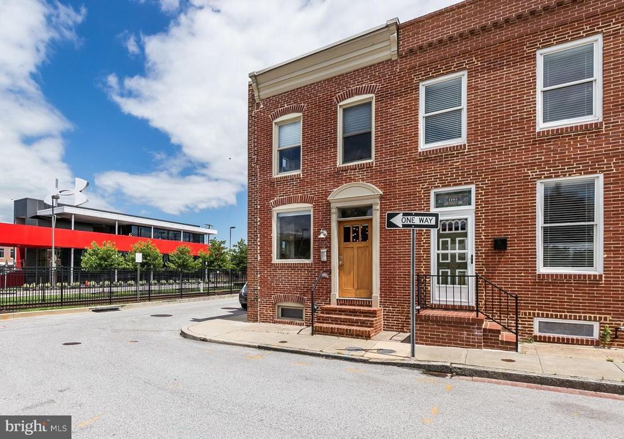ONE-OF-A-KIND jewel! This stunning home boasts the signature style & expert craftsmanship of John Bolster w/ Sandtown Millworks - creating the perfect marriage of modern & rustic from the floating stairs to the custom cabinetry, barn doors & exposed ductwork. Incredible 360-degree urban skyline of UnderAmour campus, Domino Sugar & more from the huge roof deck w/ gas fireplace.  Entertain & enjoy!