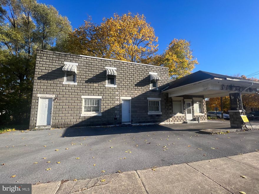 Investor property!! Right off a well traveled street, this commercial, mixed-use property holds a lot of potential for the right investor and a perfect business opportunity for a small business owner. The main level was used for business space, previously a gas station/convenient store and barber shop. This level includes an open waiting area and included business/office space. It also includes one and a half bathrooms. The main level grants access to the full unfinished basement and apartment upstairs. There are five doors that supply private, separate entrance from outside. The second floor was used as a one bedroom apartment. This apartment includes a living room, kitchen, one full bathroom, and one bedroom. Total flip and full renovation would be ideal to bring this place back to life. This is a prime investment opportunity, you don't want to miss out on. Schedule and check it out today!