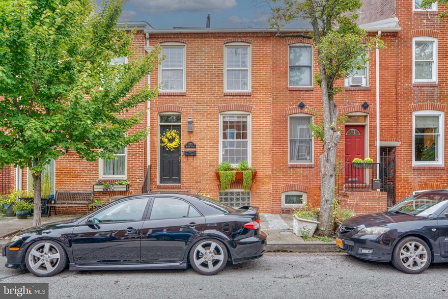 Welcome to 1129 Battery Ave, a stunning row home nestled in the heart of Baltimore, MD. This 2-bedroom, 2.5-bathroom home boasts a charming federal architectural style, with exquisite exposed brick adding character and warmth.

Step inside to discover the beauty of hardwood floors that flow seamlessly throughout the wide main living areas. Relax and unwind in the inviting living room, complete with a working fireplace that creates a cozy ambiance during the cooler months. The chef's kitchen is a culinary enthusiast's dream, featuring a gas stove, stainless steel appliances, and premium granite counters. The open layout allows for easy entertaining, while the eat-in kitchen provides a comfortable space for casual dining.

The primary bedroom has high ceilings and the bathroom offers a nice retreat with a luxurious Jacuzzi tub, perfect for unwinding after a long day. The upper level is also home to the second bedroom, second full bathroom, and the full size washer and dryer, located in the hallway closet.

This home is equipped with central heating and air conditioning for year-round comfort. The private parking ensures convenience and peace of mind, while the basement provides additional living area for movie watching or setting up a home office. Don't forget about the rooftop deck with awesome stadium and city views! 

Located in such a convenient area, this home offers easy access to nearby restaurants and all that Federal Hill has to offer. Don't miss the opportunity to make this townhouse your own and experience the best of Baltimore living. Schedule a showing today!