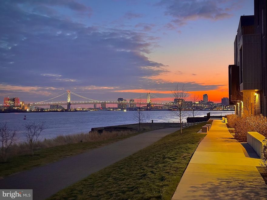 7 YEARS on TAX ABATEMENT remaining! Welcome home to waterfront living in the highly in-demand neighborhood of Fishtown. Situated just steps from the Delaware River waterfront where you have expansive views of the Ben Franklin Bridge and the river, this thoughtfully designed 3-bedroom, 2.5-bath condo is filled with natural light and loaded with upgrades and modern conveniences like an EV charger in the attached garage. It's truly the best of both worlds--serene and peaceful daily living with all the amenities of city living nearby.

The main level features an open floorplan that seamlessly connects the living, dining, and kitchen areas—perfect for everyday living and entertaining. Large windows invite in abundant natural light. The kitchen is equipped with stainless steel appliances including a gas stove, refrigerator, microwave, and dishwasher, along with a spacious island that offers additional prep space and casual seating. This level also includes a convenient powder room, a storage closet, and direct access to the attached garage parking complete with an EV charger.

Upstairs, the second floor offers three bedrooms and two full bathrooms, along with the convenience of a laundry room with upgraded wall-cabinet storage. The primary suite provides a private retreat featuring an upgraded soffit ceiling, a walk-in closet, and a beautifully appointed en-suite bath with double vanities, a frameless glass standing shower, and a separate toilet room. Just off the primary bedroom is a private side deck—an inviting spot to enjoy morning coffee or unwind in the evening.

Beyond the home itself, the Parkview Walk community offers welcoming shared spaces that create a true neighborhood atmosphere. Residents enjoy open green spaces and a communal seating areas strung with café lights—perfect for relaxing or gathering with neighbors.

Located in one of Philadelphia’s most sought-after neighborhoods, this home places you close to the Delaware River Trail, waterfront parks, restaurants, coffee shops, and all the energy that makes Fishtown one of the city’s most vibrant places to live.