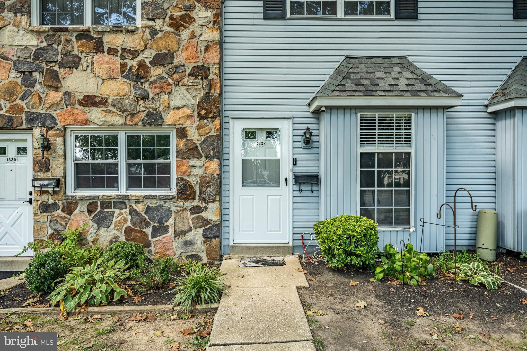 Welcome to this charming 2 bedroom, 1 ½ bath townhome in desirable Glen Estates. This home has been recently refreshed with fresh paint throughout, new neutral carpeting, upgraded kitchen and bath flooring, modern lighting and new vanities in baths. All kitchen appliances including dishwasher, built-in microwave, disposal and new refrigerator are included. There is a full, finished basement with lots of storage and a separate laundry room with washer and dryer. The sliders in the eat-in kitchen provide access to a patio with privacy fencing, and open common area with large trees. There is also a pull-down stairs to access the attic area for extra storage. The two spacious bedrooms both have new carpet, large double closets and ceiling fans. Conveniently located and just minutes from I-95 and all major routes - this home is move-in ready!
