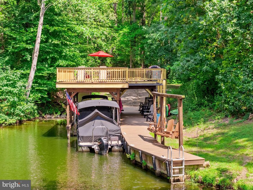 ** OPEN HOUSE - Sunday, 5/17 @ 1-4 PM ** EXCLUSIVE OPPORTUNITY on 4-ACRES, WATERFRONT ** USE 3816 BEAR TREE LANE, BUMPASS FOR DIRECTIONS ** Don't miss this RARE find with TWO ADJOINING LOTS FOR SALE! Two for the price of one with 3937 Breaknock Rd + 3816 Bear Tree Lane and a total of 4 acres with a custom, newly updated two-level dock. Located on the public side of Lake Anna in a prime location, in a quiet private cove just down from Duke's Creek Marina. This gem is tucked away to enjoy your private dock (with an electric boat lift), huge sundeck for catching the rays, enjoying the view, or entertaining family & friends. The cozy 3 BDRM, 2 BATH home boasts over 1,200 finished square feet. Renovated with a new kitchen, updated bathrooms, new flooring, new windows, siding & roof - practically a brand new house! The Kitchen has granite counters, stainless steel appliances, and updated cabinetry. Both primary & hallway bathrooms are completely renovated with custom tile work & updated fixtures. The exterior features a wrap-around deck, extension hardscaping to include a firepit area, new pole barn, and....saving the best for last....an UPDATED DOCK (Spring 2025) with composite decking and a BRAND-NEW second-level sundeck. The adjoining lot is already cleared & ready for another home, or just keep it clear and private to use for family games, gatherings, or even the perfect camping pad! Updates to include: Exterior doors (2026), Dock (2025), Pole Barn (2023), Primary Bath (2020), Deck & Patio (2019), Kitchen & Hallway Bath (2017), Mechanicals (2017), Roof (2016). This convenient location is just down the road from Elk Creek Country Store, Lake Anna Taphouse, Vito’s Pizza, Asian Café, and New Bridge Landing (groceries, ABC, nails, and more). Lake Anna is centrally located—only 45 minutes to Richmond, Charlottesville, and Fredericksburg, and about 90 minutes to D.C. Don’t miss this rare opportunity to purchase two lots for the price of one on Lake Anna. Schedule your private showing today and experience lakeside living at its finest!
