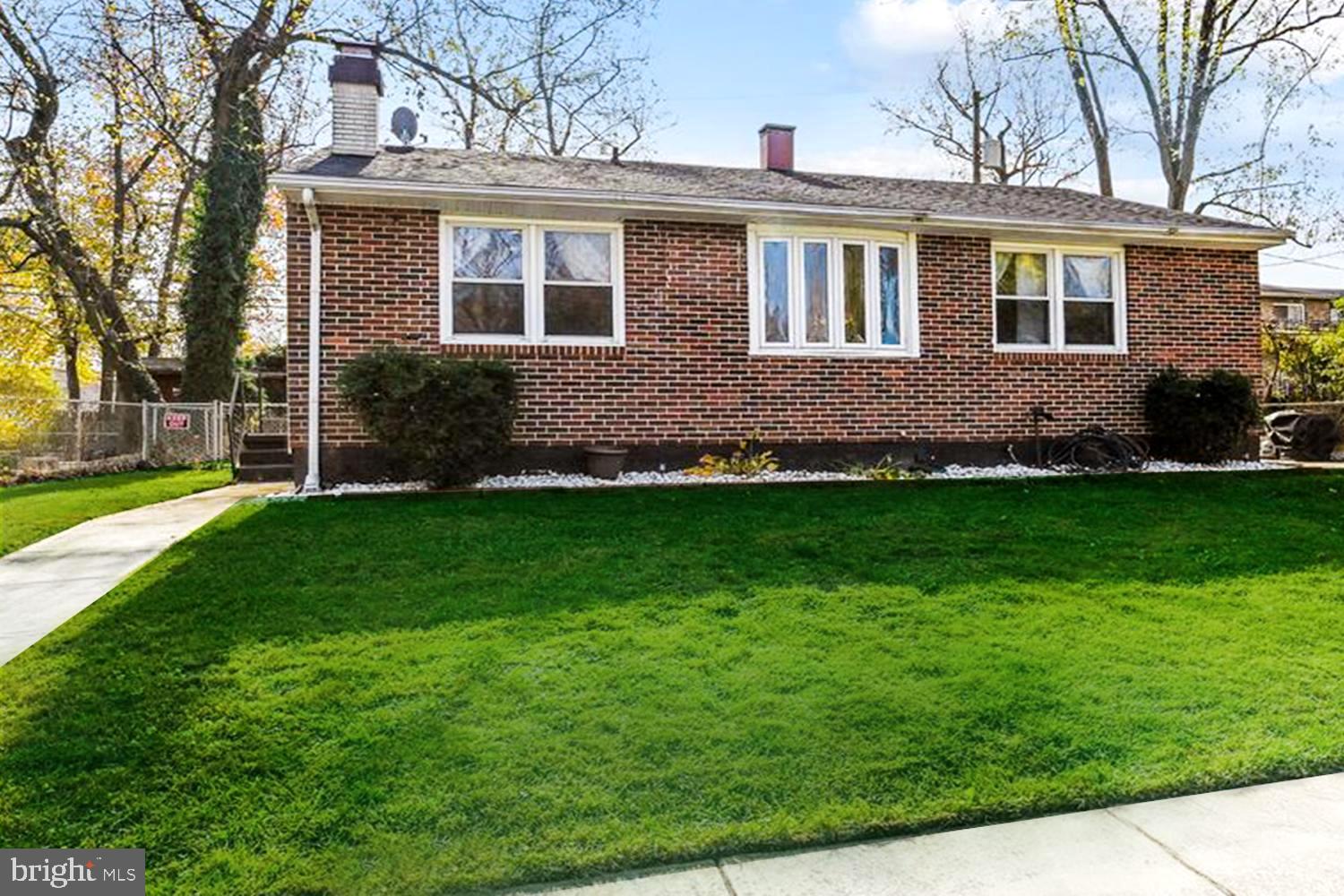 CHARMING OPEN CONCEPT REMODELED COTTAGE with 2 PATIOS and large fenced rear yard! LOTS NEW and IMPROVED !!! 3BR/2BA Home professionally painted in turnkey neutrals; hardwood floors; Living & Dining Rooms sharing fireplace ambiance; remodeled stainless Kitchen w/NEW Corian countertop & mosaic backsplash; newer carpet in upstairs Bedrooms; decorative tiled Baths including lower level spa tub. Current owners use one section of the finished recreational basement as a Primary BR with ensuite whirlpool Bath. Fun fenced yard for pets & play with front entry grilling patio, rear fire pit gazebo, and detached storage shed. Multi-vehicle driveway parking. GREAT LOCATION convenient to commuter RTs 100 / 97 / 695 / 50. A mere 20 minutes from both Baltimore and Annapolis harbors! Sellers just lowered price. Sold ASIS.