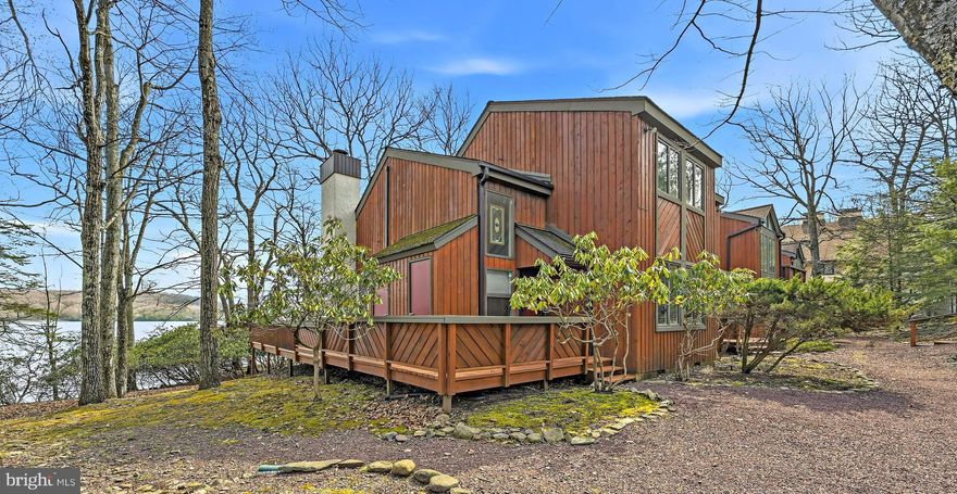ONLY LAKE FRONT - END UNIT currently on the market. Stunning LAKE FRONT view with a large wrap around deck to enjoy all of the views. This end unit has the best views in the Blue Heron community. The 2 bedrooms, with loft area and 2 full bath end unit townhome is perfect as a vacation getaway or as a full-time resident. Take notice of lake views from even inside of the home, just magnificent! This home has central air for year round comfort and is being sold furnished making it move in ready. Bright and inviting, this home offers the perfect setting to create lasting memories with family and friends. Enjoy peaceful surroundings with your lakefront views and convenient access to the private community lake club. Just a short 20 minute drive to Jim Thorpe, ideally situated across the lake (one minute drive) from Big Boulder Ski Area and approx. 15 minutes from Jack Frost Ski Area. Minutes from local shops, restaurants, scenic walking paths and Hickory Run State Park for some great hikes, making it perfect for winter skiing, summer relaxation, and everything in between. Schedule your showing today to experience this beautiful property and make it yours. This property is a perfect location and may offer excellent potential for short term rental use, subject to local & community guidelines. Seller has shared some photos taken, most from their deck for you to enjoy as much as they have. Seller is PA licensed Realtor.