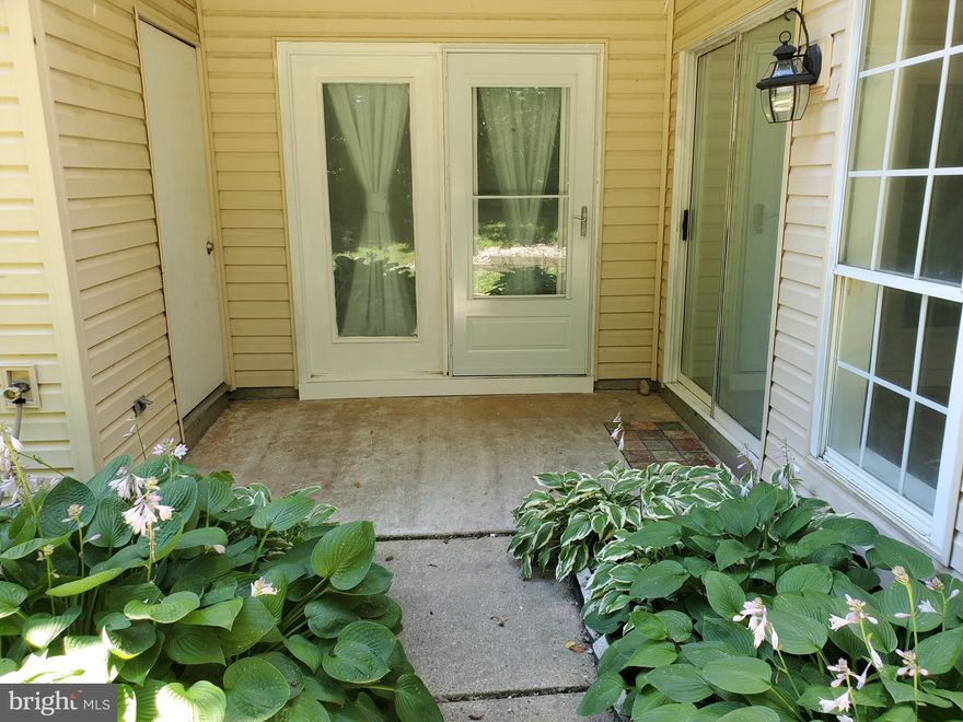 Location is a 10, close to major highways, shopping, local restaurants.  Even better than that it is a ground floor unit with a patio entrance!  Relax on the private patio and enjoy nature.  This 2 bedroom, 2 bath unit features, wood laminate flooring thru-out, recessed lighting (pot lights).  Granite counters, newer appliances, and recently painted.  Its Turn key and ready and waiting.