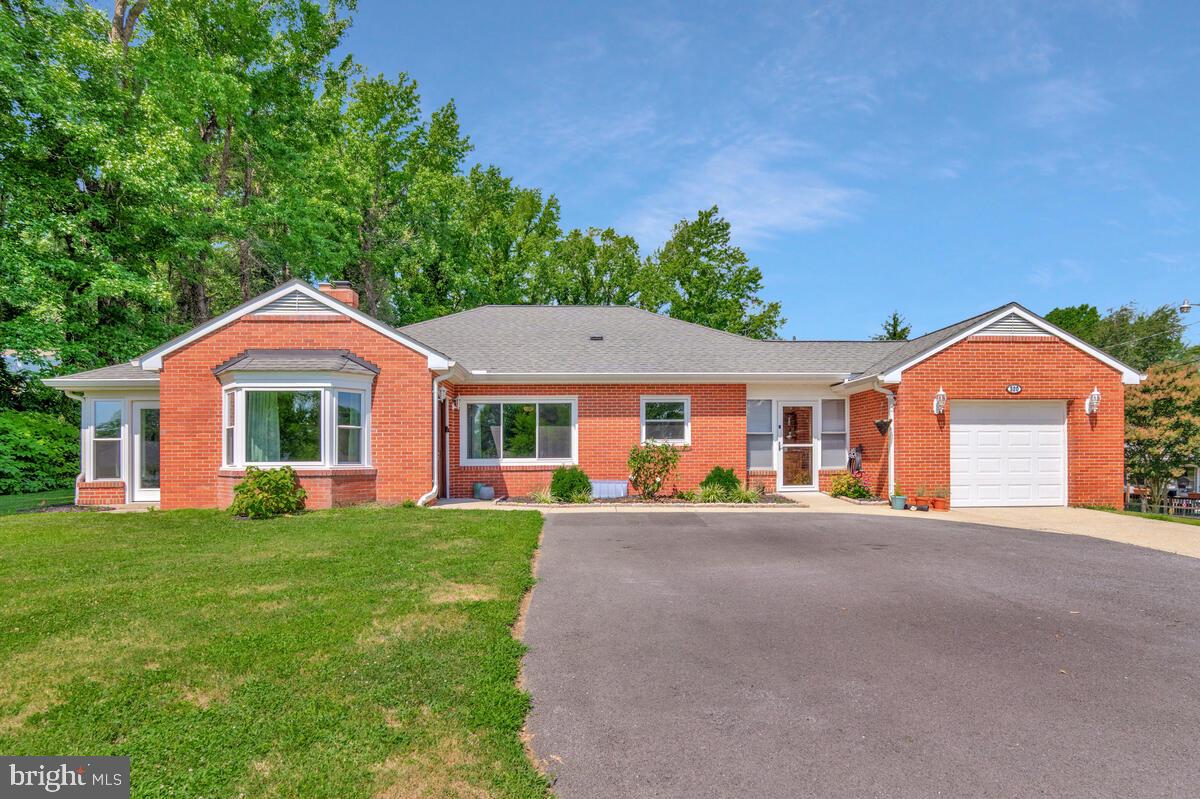 Dive into the heart of Calvert County and take in your poolside paradise! This rare all-brick rambler sits on a coveted corner lot just a short stroll to the Chesapeake Bay and neighborhood water access with a boat ramp. Inside, you’ll find a classic design refreshed with modern touches: a sun-filled open floorplan, rich hardwood floors, and an updated kitchen featuring granite countertops, stainless steel appliances, and stylish cabinetry. The expansive living room centers around a cozy wood-burning fireplace and flows seamlessly to a tranquil screened porch—ideal for morning coffee or unwinding with a book. All bedrooms are generously sized, offering comfort and space. The fully finished basement adds incredible versatility with a rec room, additional bedroom, dedicated office, and abundant storage—plus top-of-the-line front-loading washer and dryer. Step into your own backyard oasis: splash into the in-ground pool, grill out on the patio, and gather around the firepit as stars fill the sky. The fully fenced rear yard includes an oversized storage shed and plenty of room for play and entertaining. Recent upgrades include a dual-zoned HVAC with oil backup, architectural shingle roof, newer windows, and ample parking via an expanded driveway. With proximity to shopping, dining, military bases, Annapolis, and D.C., this property offers not just a home—but a lifestyle you’ll fall in love with.