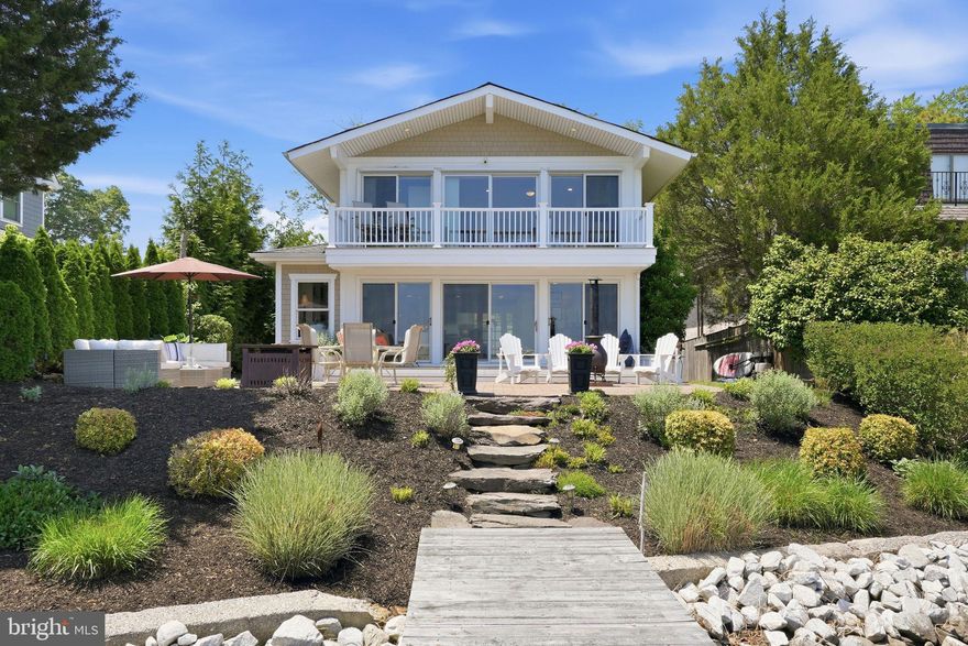 This coastal home in the sought-after Chalk Point community offers the best of waterfront living. Wake up in the waterfront primary suite with sweeping 180-degree views and enjoy your morning coffee from the private balcony overlooking the water. Designed for both privacy and entertaining, the home features a spacious deck and patio off the main living area, perfect for outdoor gatherings and waterfront entertaining.

The private pier w/ 5ft MLW includes three boat lifts — one 20,000 lb lift and two 2,800 lb lifts — plus a mooring ball just off the pier offers deeper water. Spend your days boating, crabbing, or enjoying easy access to waterfront restaurants on the West River.

Inside, the home offers 3 bedrooms and 2.5 baths, hardwood floors throughout, and an updated kitchen with stainless steel Thermadore appliances, granite countertops, and tile backsplash. Recent updates include a new HVAC (2025) & pellet stove (2024).  An oversized detached two-car garage provides abundant storage, including attic space, with the potential to create finished living space above in the future. 

Conveniently located just 45 minutes to DC and 25 minutes to Annapolis, with several nearby golf courses and access to memberships at Chesapeake Yacht Club, West River Sailing Club, and the waterfront pool at West River Yacht Harbor. Enjoy going to dinner by boat at Galesville’s two waterfront restaurants just a few minutes away!