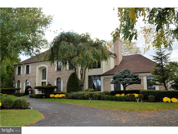 Welcome home to 14 Colts Neck Drive in Upper Makefield. This absolutely stunning home is filled with state of the art high-end finishes and endless upgrades throughout. Much thought and detail went into the renovations of this beautiful home. Enter into the gracious 2 story foyer with turned staircase and marble floors and take note of the custom millwork that will be evident throughout this home. Dramatic formal dining room with hardwood floors, custom millwork and sun drenched formal living room with hardwoods, custom window treatments and custom millwork. Through the French doors is the study with custom mahogany raised paneling, stunning marble surround fireplace and fabulous custom designed finishes. The heart of the home is the incredible renovated kitchen and family room. No detail was overlooked in this renovation. Natural Cherry custom cabinetry throughout the kitchen with granite countertops, granite farmhouse sink, wet bar with copper under mount sink, top of the line appliances, plumbing fixtures, and raised custom paneling. Great planning and care was taken into every aspect of the kitchen and family room with stone wall to ceiling fireplace and open floor plan conducive to entertaining. Skylights were added to the breakfast room, French doors were added for access to the backyard oasis, and an open, warm living area was the result. Additional bedroom with full bath is located on the first floor. Move upstairs to a sumptuous master bedroom and master bath. Master bedroom suite has sitting room with custom built-ins, marble surround fireplace, columns and faux finish paint. Master bath with columns, natural cherry cabinets with granite countertops and raised paneling. Three additional bedrooms and bath complete the second floor. Finished Daylight basement with wet bar/kitchen is the perfect entertainment area that has custom built-ins, stone fireplace. The backyard of this property is an oasis of privacy and beauty backing to open space and filled with perennials, specimen plants and beautiful landscaping and hardscaping. This property needs to be seen to be appreciated.