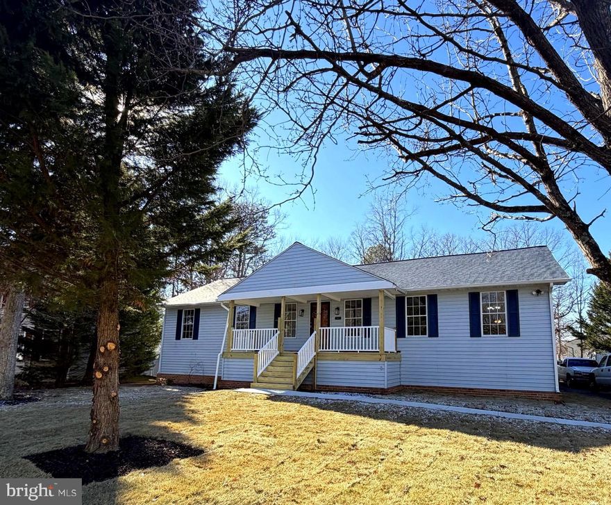 This one-of-a-kind, fully renovated raised rambler offers nearly 3,000  total square feet of living space in a convenient northern Waldorf location with no HOA, complete with a new roof replaced in 2024!  From the brand-new front porch, step inside to the welcoming entryway where updated finishes, recessed lighting, and stylish LVP flooring set the tone throughout the home. Just off the entryway is a formal sitting room, with the home opening into a spacious family room centered around a wood-burning fireplace.
The large galley kitchen features stainless steel appliances, beautiful soft-close cabinetry with ample storage, a pantry, an eat-in area, and a formal dining room just off the kitchen—perfect for everyday living and entertaining.
The spacious primary suite offers new carpet, a walk-in closet, and a beautifully tiled  shower/tub combo. Two additional main-level bedrooms are generously sized and also feature new plush carpet. A main-level laundry room adds everyday convenience.
The fully finished basement provides additional living space, including a room that could be used as a fourth bedroom, a full bathroom, and a walk-out entrance.
Set on nearly half an acre, this property also includes an oversized attached carport and a covered patio overlooking the backyard. Located just minutes from commuter routes, shopping, restaurants, and schools, this home has it all!