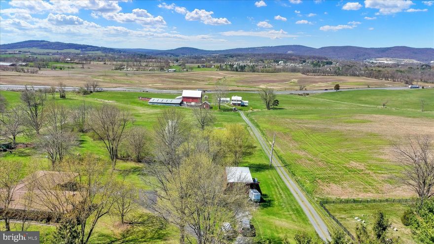 Set against the scenic backdrop of rolling countryside, this exceptional 45.5-acre property at 612 Capitol Hill Road in Dillsburg, PA offers a rare blend of history, versatility, and opportunity. With an impressive 947 feet of road frontage, this expansive parcel invites you to imagine, create, and cultivate a lifestyle rooted in both charm and potential.
At the heart of the property stands a historic stone residence, originally built in 1815 by Jacob and Elizabeth Larue. The home serves as a reminder of the land’s deep agricultural roots while offering a unique foundation for restoration or modernization. Surrounding the home, large barns and outbuildings provide ample space for storage, farming operations, or creative repurposing; perfect for those seeking a working property or a private rural retreat.
Once a thriving farm that supported over 1,000 chickens and 200 pigs, this land played a meaningful role in the local agricultural economy. Over time, the property evolved with the surrounding infrastructure and is now uniquely divided by Route 15, with approximately 7–8 acres positioned on the west side of the roadway. 
Today, the land stands ready for its next chapter. The property’s Open Space zoning presents a wide range of possibilities, from continued agricultural use to residential development; buyers are encouraged to explore permitted uses and envision the full potential this acreage holds.
With a minimum 2-acre lot requirement for residential use, the property offers an exciting opportunity for subdivision or the creation of a private estate community, all while maintaining a sense of space, privacy, and natural beauty. Whether you’re dreaming of a homestead, an investment opportunity, or a legacy property to pass down for generations, this land delivers unmatched flexibility.
Located in a peaceful and picturesque setting, yet still within reach of everyday conveniences, this property captures the essence of rural Pennsylvania living. Opportunities like this; where history, acreage, and future potential converge; are truly rare. Come walk the land, breathe in the possibilities, and bring your vision to life.