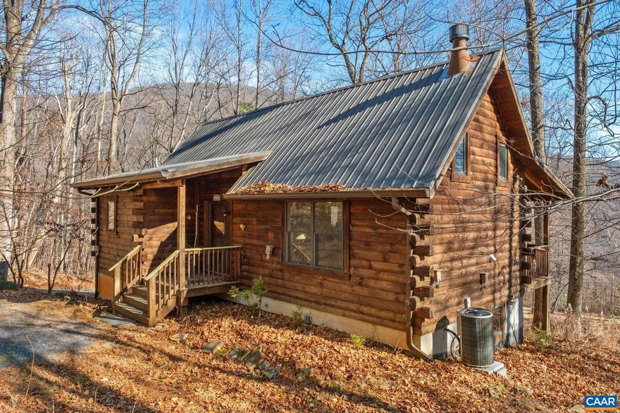Absolutely charming log cabin on 8.24 acres in Nellysford!  and there are lovely mountain views from this tucked away location. Handsome greatroom with wood flooring, cathedral ceiling and a lhandsome wood burning fireplace. The kitchen is sweet with barnwood cabinetry and granite countertops. The master is on the main level and the full bath across the hall has a large soaking tub, double sinks, tiled flooring and very attractive fixtures. The loft could be used as another sleeping area or an office/extra living space. The basement has a single bedroom, a full bath and the laundry area. There is a large unfinished room that has been used for storage but if finished, could provide another bedroom or den. Relax on the front porch or take a hike through the woods. There is also a large, cleared fenced area in the back for pets or gardening. Firefly fiber optic is already installed. Minutes to all of the Nelson 151 breweries, cideries, wineries and distilleries. And Wintergreen Resort is just up the road for golf, skiing and tubing, tennis, hiking and swimming!,Granite Counter,Wood Cabinets,Fireplace in Great Room