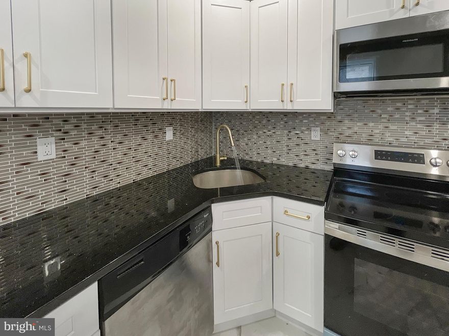 2 story, 2 bed, fresh renovation, granite, carrara stainless, hardwood floors in a neighborhood where they sometimes block off the block so the children can play in the streets.  
West Philly's Garden Court offers entertainment and parks. Features include a new forced warm air system, concrete backyard, front porch and hand painted staircase details.  Black Galaxy Golden Granite tops, glass backsplash, French style stainless refrigerator, microwave and gas range.  Programs with grants and mortgage to have a lower monthly payment than a rental, and then call it you own home!