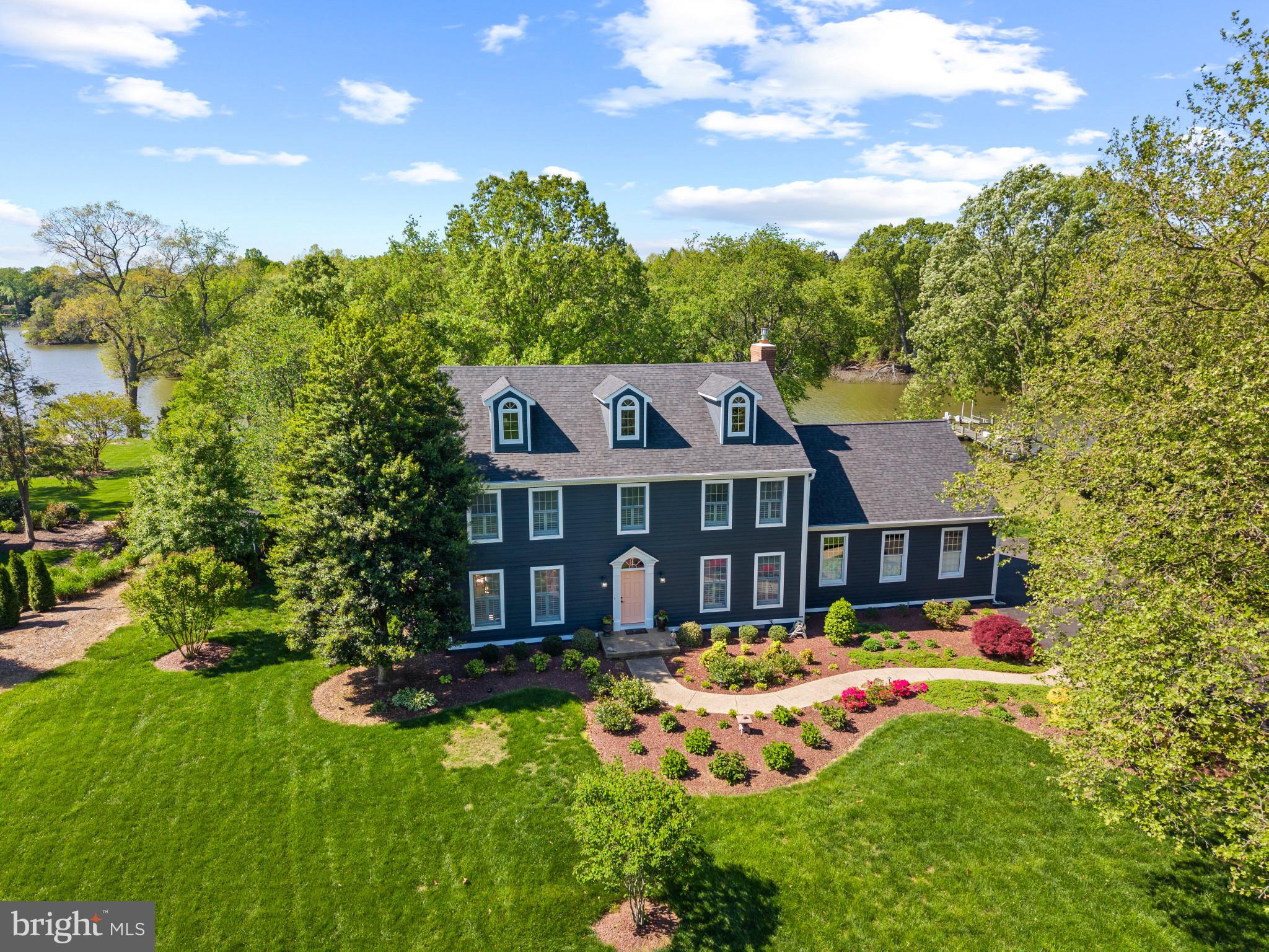 Welcome home to this beautiful waterfront home situated on just over an acre and a half of land in the peaceful Wye Harbor community in Queenstown, minutes from Route 50. Enjoy Wye River water views throughout, multiple living spaces, a large sunroom facing the water, plenty of storage, and an unfinished attic space perfect for a recreation room or additional storage. This home has something for everyone!
As you enter, the foyer provides access to a beautiful stairway or either of the two formal living areas. Boasting the perfect blend of open concept and traditional layouts, the formal living room off the foyer seamlessly integrates into the formal dining room with direct access to the kitchen and open concept living and dining spaces overlooking the Wye River. The large living space features high ceilings and direct access to the sunroom, with some of the best views of the River! The two car garage can be accessed via the mud room connected to the living space as well.
The primary suite features a spacious room with a farm house style bathroom and an oversized walk in closet that leads to another unfinished room - the potential is endless! This space could be the perfect dressing room, extra storage, or whatever you can imagine. The three additional bedrooms upstairs offer plenty of space for guests am additional storage. Inside one of the bedrooms, you’ll find a hidden stairway leading to the unfinished upper level, currently used as a recreation area and the perfect spot to add additional square footage to this already spacious home.
Outside, you’ll find a beautifully manicured lawn, mature landscaping, and a pier with 3-4ft MLW as well as electric and water. The Wye River is one of the most premier spots for boating in Maryland, perfect for a cruise around Wye Island or taking a quick trip to Saint Michaels, the Narrows, and beyond.
Wye Harbor is located minutes away from Route 50, the emergency room, doctors, and the Queenstown Premium Outlets. Just a short drive to Kent Island, Annapolis, Easton, Saint Michaels, Centreville, and beyond. The community doesn’t have an HOA, however they regularly schedule social events and get togethers. Schedule your tour today to learn more about what the Eastern Shore and this community have to offer!