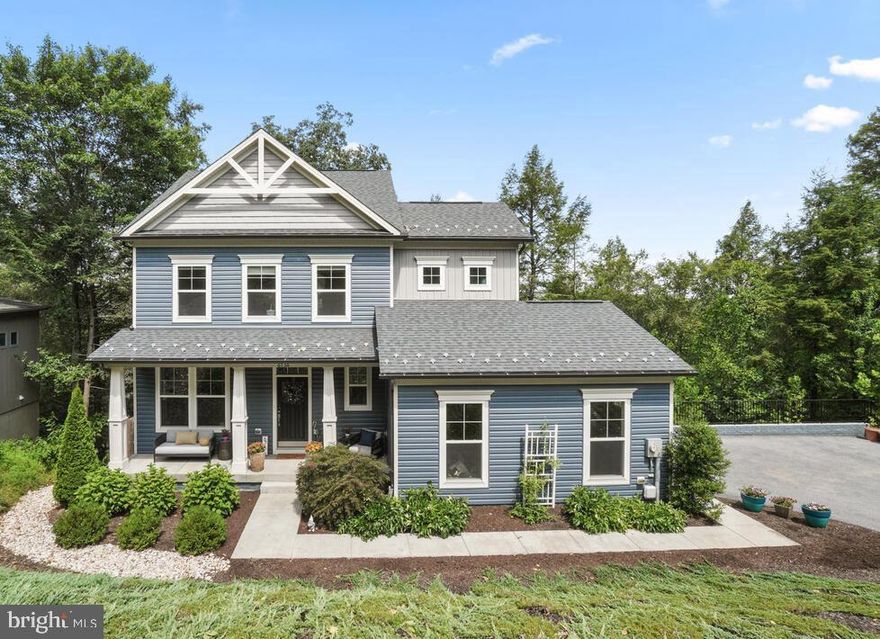 Nestled in highly sought after Lake Linganore this custom built 3 bed/2.5 bath home + two car garage that backs to the lake AND mature trees is a RARE gem! 

Special features include:  built in 2018 by C.E. Rensburger (one of the most sought after custom builders in Lake Linganore). Architectural shingle roof with snow guards (helps snow gradually melt in order to preserve gutters) charming front porch with green space views for ultimate privacy, lush mature thoughtful landscaping throughout property (Peonies bloom in the spring), extended driveway to allow ample parking in addition to a garage with a plug for an electric vehicle and hose bib on the interior makes it easy to water plants or a garden. In addition to 2 hot water heaters for hot water on demand. As you enter you will notice beautiful flooring,  half bathroom conveniently on the main level across from the office/playroom/gym or additional room. 

The heart of the home is the stunning open concept kitchen with granite countertops, built in microwave, walk in pantry. Through the sliding glass doors off the kitchen is a deck with lake access and mature tree views perfect for entertaining and relaxing. The cathedral ceilings add an abundance of natural light and the cozy fireplace is perfect for gatherings. The unfinished basement offers TONS of opportunities to make an additional room, gym, gathering area and the options are endless. Basement already has a rough in for a full bath and partial framing in addition to high ceilings! Walk through the basement sliding glass doors on an ultra 2nd private deck that is serene and peaceful with  mature trees and views of the water. 

Welcome to the upper level where laundry is conveniently located on the bedroom level in addition to all 3 rooms with 2 full bathrooms. Primary bedroom has an ensuite with luxurious soaking tub, separate shower, AND a walk-in closet, a closet organizer including drawers and custom shelves. The second full bathroom on the bedroom level has a bathtub/shower combo and convenient dual vanity. 

This location is not just a home AND a whole community! The HOA provides festivals (fall, winter, and summer) food trucks come to the neighborhood, farmers market, concerts in the summer with LIVE music, there are 4 in ground pools, tennis courts, basketball courts, beach volleyball, two beaches (white sand is brought in every year) kayaking, boating, bicycle paths, swimming, disc golf, 30 miles of hiking/walking trails, golf carts, and events. This neighborhood is truly a gem! In addition to the community you are minutes away from all major commuter routes to D.C., V.A., Baltimore and MoCo. Wegmans, Starbucks, Chick-fil-a, Lowes, Walmart, Home Goods, At Home, Marshalls, Restaurants, Parks, Downtown Frederick and so much more is a short distance away. 

Schedule your showing today!