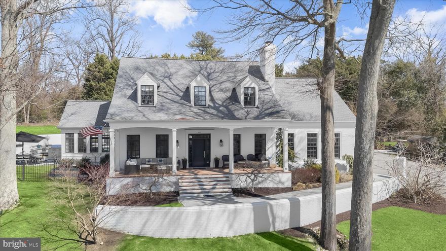 Originally built in 1988 and extensively renovated and lovingly reimagined by the current owner over the past fifteen years, this extraordinary, white-painted brick residence blends timeless Southern architecture with thoughtfully curated contemporary design. Spanning 5,641 square feet across three levels and set on just over one acre (45,737 square feet), the home offers rare scale, privacy, and elevated positioning overlooking tranquil Otter Pond.
Graciously sited atop a gentle hill — well above flood concerns and any cars or golf carts on the street below — the home enjoys both commanding presence and peace of mind. Traditional in form and crowned with three matching cupolas, the exterior evokes classic Island architecture, while the interiors unfold with architectural ceiling treatments, refined millwork, custom solid wood doors with new brass hardware, newly refinished wood floors, curated finishes, and modern systems designed for today’s living.
This beautifully designed house is turnkey and ready for a new owner with a clean white brick façade, black-framed windows, and a white brick retaining wall that establishes strong curb appeal. As the driveway ascends, the columned front porch stretches across the façade — an inviting perch for morning coffee or sunset views over Otter Pond.
Designed for exceptional outdoor living, the private rear terrace unfolds into a beautifully integrated heated pool and spa retreat. The freeform pool with adjoining hot tub was completely refinished and renovated with all new piping, systems and equipment in 2022 and is surrounded by expansive Afyon cloud marble hardscaping and crisp white brick walls, creating a secluded, resort-like setting framed by mature trees and lush landscaping.  The pool and hot tub equipment, heater, cleaner and lights are all Wi-Fi/App controlled.  
A newly built Afyon cloud marble patio with grass dividers and fully equipped outdoor kitchen connects the pool area to the sunroom and elevates the outdoor living, featuring a built-in Coyote gas grill and dual cooktop burner, under-counter refrigerator, generous prep space—perfect for classic Maryland crab feasts and effortless summer entertaining. Whether hosting large gatherings or enjoying quiet evenings poolside, the layout offers seamless flow between dining, lounging, and cooking areas. Both refined and relaxed, this outdoor sanctuary embodies the very best of Gibson Island living—private, polished, and designed for making memories all season long.
Ample parking at the top of the drive and an oversized two-car garage offer exceptional functionality rarely found on the Island.
Information on Gibson Island:
Gibson Island is a private island within one hour of Washington, D.C. and Baltimore offering an absolutely extraordinary setting.  The Island comprises 1000 acres with seven miles of shoreline. Two thirds of the Island is undeveloped and is owned by the Gibson Island Corporation, the homeowners' association.  The remaining third is residential home sites. 
Gibson Island is located on the western shore of Maryland, so there is no need to cross the Bay Bridge. On the Island is a 43-acre spring fed freshwater lake in which one may enjoy non-motorized watercraft activities such as paddleboarding, canoeing, kayaking, fishing and swimming.  
The Island offers enormous privacy and security--there is an entry gatehouse staffed 24+Hours, and the Island is patrolled by the Gibson Island Police Force (GIPD).  The Gibson Island Corporation Service Department offers yard maintenance and landscaping and other services for homeowners.  There is a full-service yacht yard.   From the Island, it is just a 20-minute drive to BWI Airport and the neighboring Amtrak train station.  
The Island houses a private country club (membership by invitation) offering yachting, fine dining year-round, tennis, an award-winning Charles Blair Macdonald designed 9-hole golf course, swimming, croquet, skeet shooting, and more.  (C)