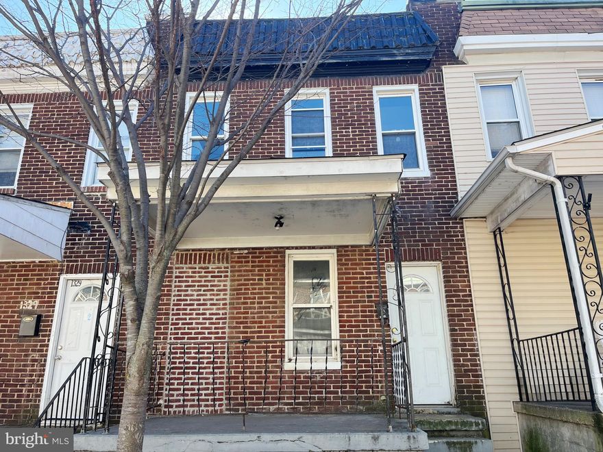 Spacious all brick townhome featuring three roomy bedrooms upstairs. Large backyard and back alley parking. Bring your vision and make this home stunning again.