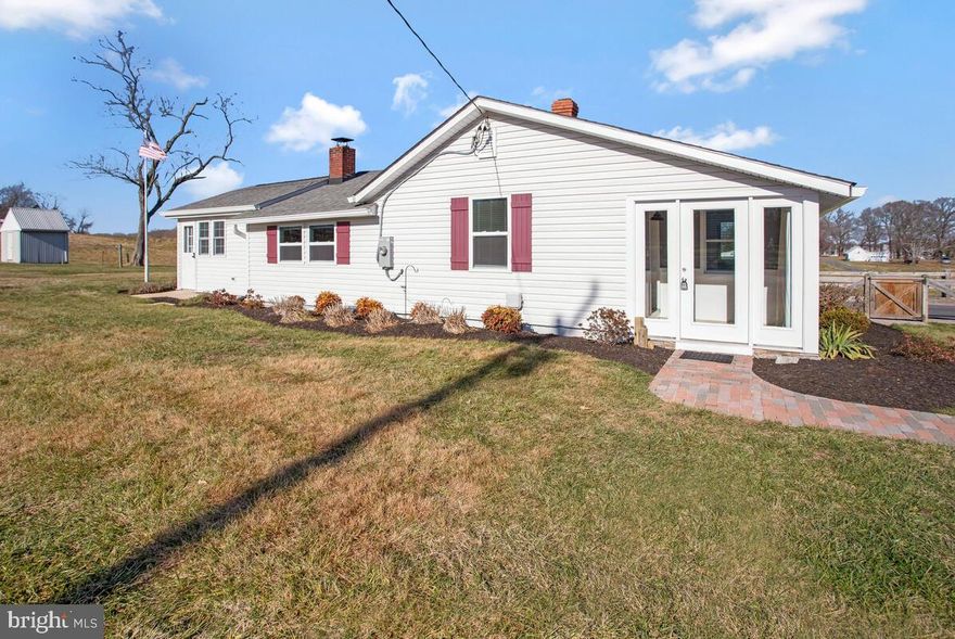 Charm meets style and character with this farm style rancher!! A true unique opportunity to take in peaceful living on a wide-open property that’s just seconds from Rockhold Creek and the Chesapeake Bay!  This completely updated one-level living home has tons to offer with its light-filled floorplan including a spacious foyer/entry with ceramic tile, open living room that leads to the custom remodeled eat-in kitchen with stainless steel appliances, to include a high-end gas Bosch range and hood vent, as well as beautiful brickwork and shelving.  The main level also features a private owner’s suite with full bathroom, as well as a den/office/sitting room! The owner’s suite leads to a large deck with incredible views of farmland and Rockhold Creek and marina in the distance!  The second bedroom has its own full bathroom with beautiful ceramic shower.  There is a mud/laundry room with a powder room leading to the rear deck!  Other features include new siding, roof, windows, light fixtures, freshly painted, and an energy saving tankless water heater!  Nearby marinas, fishing, kayaking, dining, shopping, gyms, and a very easy commute to Joint Andrews, Annapolis, & D.C.  Enjoy everything the Chesapeake Lifestyle has to offer!