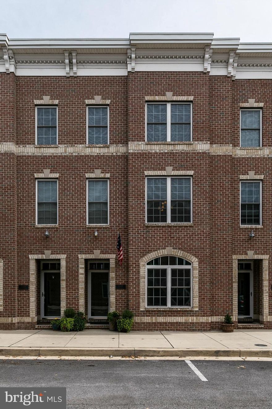 Spacious garage TH located in Locust Point: 3 bedrs (1 on entry lvl), 3.5 baths, gourmet kitchen w/granite*breakfast bar*stainless appls* spacious living rm w gas FP, Bose sound system, trex deck off livingroom.  Huge roof deck w 360 degree city & Key Bridge, Domino views. 2 car garage + room for 2 more! 1 block to Under Armour Hqtrs, promenade w water taxi stop & near Ft McHenry & Latrobe Parks.