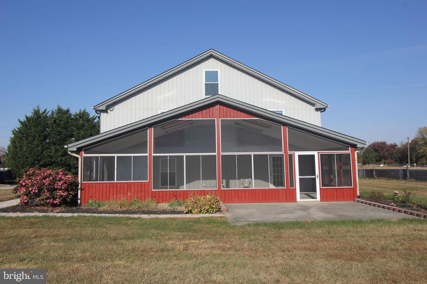 This property is a dream for anyone looking for ample space, both indoors and outdoors! This spacious 5 acre property in the country boasts a 40’ x 80’ conditioned pole building with 2” x 6” framing. The front 40’ x 60’ garage space features 2 commercial garage doors and three dedicated office spaces making it ideal for hobbyists, entrepreneurs, or anyone needing a large workspace. The 2076 sq ft living space includes 2 large bedrooms (15’ x 15’ and 13’ x 20’) and 2 full baths upstairs with lots of storage space. The flexibility of the upstairs living space layout with truss attic and flooring  system is a big plus, offering easy customization. The first floor features a kitchen with generous pantry space as well as a laundry area, half bath, and spacious living room. The large screened porch (36’ x 16’) is perfect for enjoying a cup of coffee while relaxing and taking in the country views or hosting a crab feast with family and friends. Plus, the proximity to Middletown, DE adds convenience without sacrificing the rural appeal.