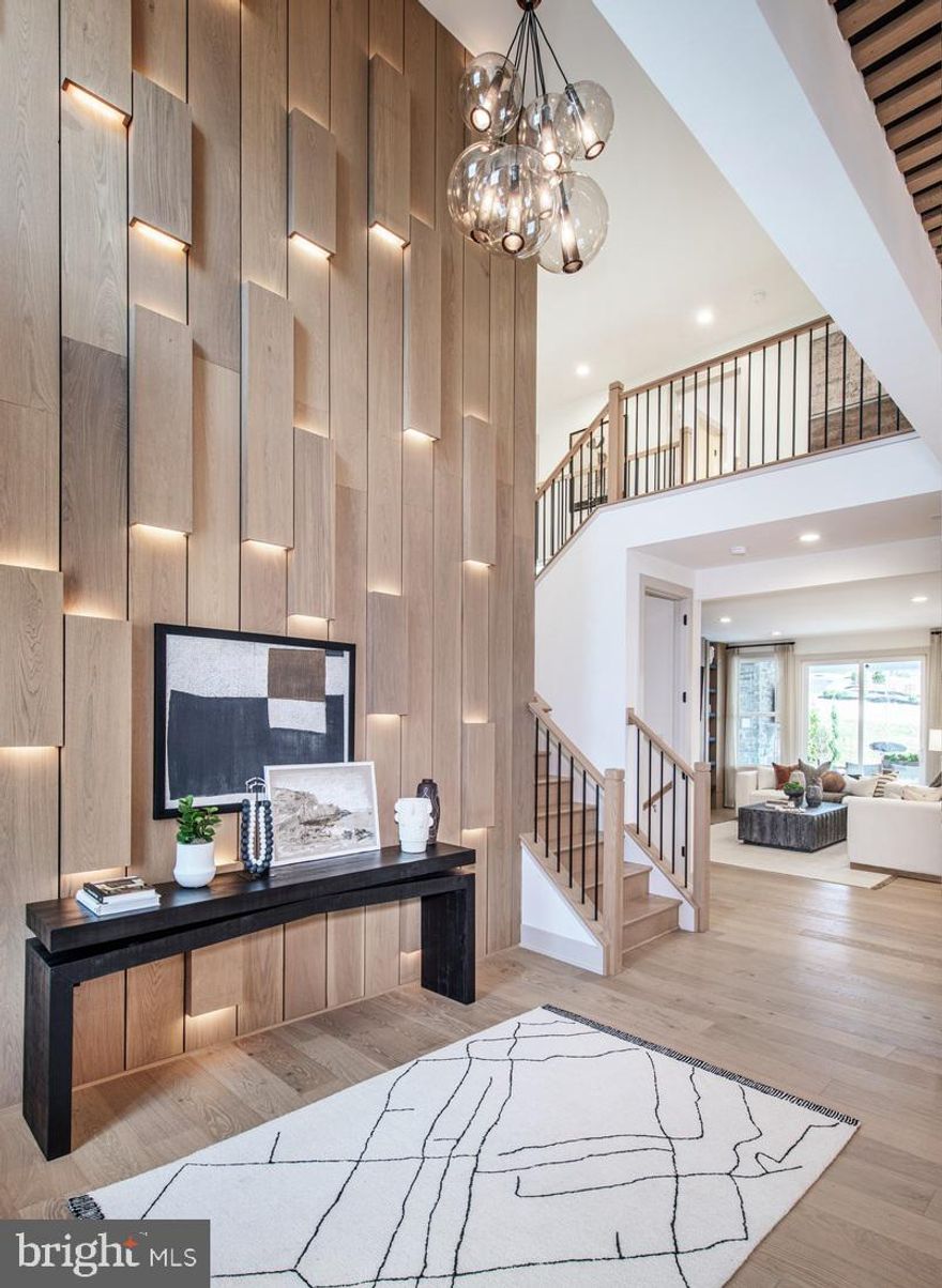 This exceptional Toll Brothers model home showcases a remarkable blend of luxury design, thoughtful upgrades, and elevated living spaces, offering a truly turnkey opportunity. Expertly appointed throughout, the home features extensive hardwood flooring across the entire first floor, upper hall, and primary bedroom, complemented by a fully upgraded interior and refined, modern lighting that enhances every space.
Designed for both everyday living and sophisticated entertaining, the expansive outdoor living area includes a covered retreat with a fireplace, an extended hardscaped seating area with a fire pit, and a fully equipped outdoor grill—creating a seamless indoor-outdoor lifestyle experience. Inside, a finished basement offers abundant space for recreation and leisure, including a dedicated private gym.
The well-appointed kitchen is equipped with premium Jenn Air appliances, and the home includes a refrigerator, washer, dryer, and all appliances for added convenience. Professionally curated model home furnishings are also included, delivering a cohesive and elevated aesthetic throughout.
Versatile living spaces include a private office, a flexible room currently staged as a dining area, and a separate casual dining space ideal for everyday meals. Every detail has been thoughtfully designed to reflect the quality and craftsmanship synonymous with Toll Brothers.
This beautifully appointed residence will be ready for delivery in October, presenting a rare opportunity to own a fully furnished, professionally designed model home. Pictures are of actual home. You cannot beat this location with access to all shopping and dining in the local areas. The community is also convenient to major highways including I-76, Routes 422, 202, and the PA Turnpike.