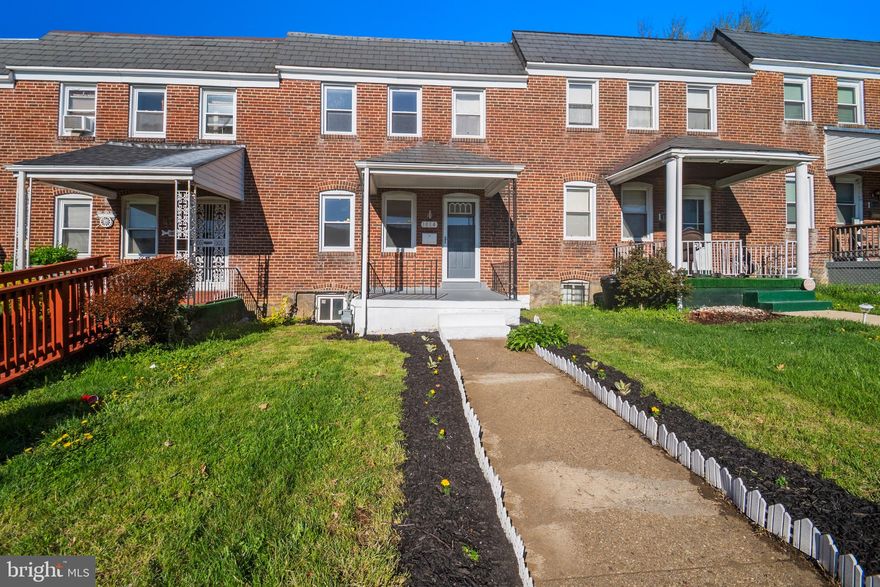 Welcome to this beautifully updated brick rowhome offering classic charm with modern finishes and an open, functional layout. A welcoming front lawn and covered porch set the tone as you step inside to a spacious, sun-filled main level featuring gleaming hardwood floors and a seamless flow between the living and dining areas-ideal for both everyday living and entertaining. The updated kitchen is thoughtfully designed with crisp white cabinetry, granite countertops, stainless steel appliances, gas cooking, and a stylish tile backsplash. A breakfast bar provides additional prep space and casual seating while maintaining connection to the main living area. Upstairs, you’ll find comfortable bedrooms filled with natural light and a full bath, offering a practical and inviting layout. The home’s neutral palette and clean finishes make it truly move-in ready while still offering the opportunity to add your own personal touch. Enjoy outdoor living with a front yard space perfect for relaxing or gardening, all set within a well-established neighborhood. Conveniently located near major commuter routes, shopping, and dining, this home is an excellent opportunity for both homeowners and investors alike.