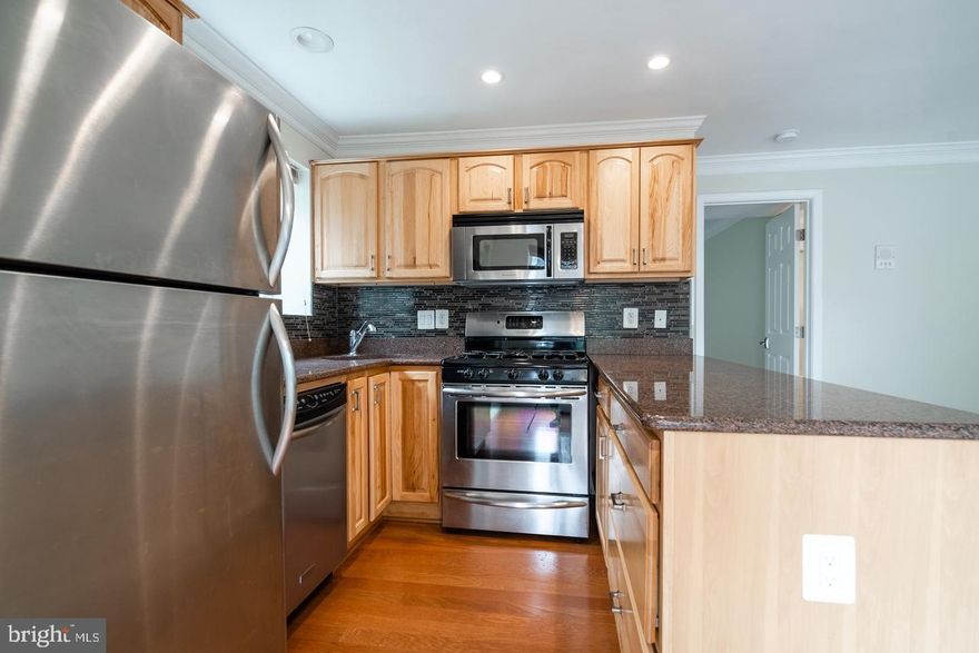 Introducing this radiant and expansive 1-bedroom condo, complete with its very own dedicated parking spot (#1)! 

***Available Starting July 5th***

Situated just moments from the vibrant Clarendon area, the building features a serene courtyard with a communal grill at the rear. Inside the unit, you'll find an open floor plan complemented by stainless steel appliances, hardwood floors, a washer/dryer, and a charming balcony. 

Please be aware that no pets are allowed. Revel in the convenience of being mere minutes from Clarendon, with effortless access to routes 50, 66, and 395, as well as being less than a block from public transportation.

Water and trash included in the rent!