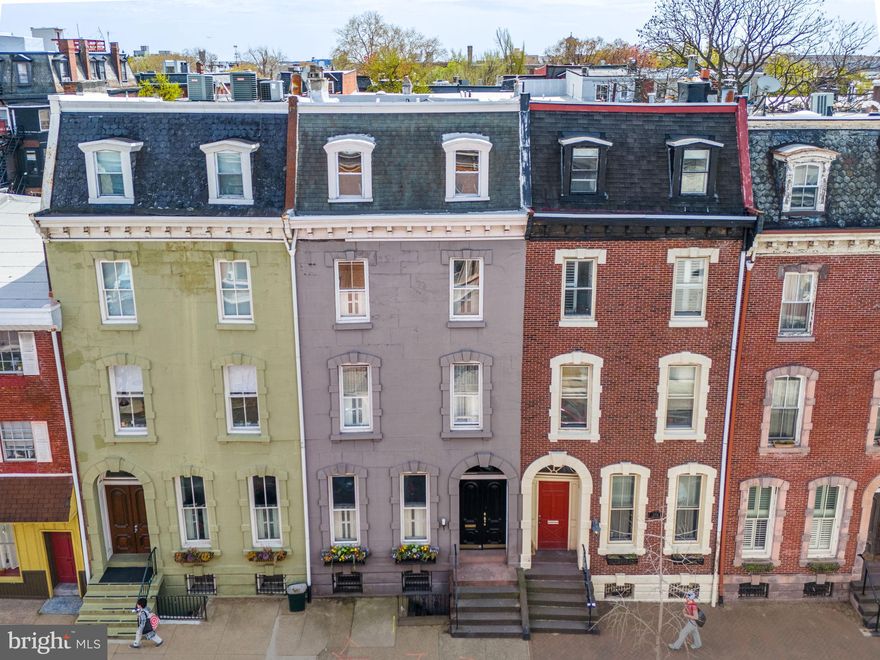 Welcome home to 2304 Spruce Street. This spectacular townhouse in Philadelphia’s charming Fitler Square neighborhood is the perfect blend of old-world elegance and modern comfort. The home received a major renovation in 2022, including a professionally-designed kitchen by one of Philadelphia’s leading interior design firms, new and refurbished hardwood flooring throughout, an updated exercise and wellness room, and much more. Please reach out for a complete list of the many renovations.
The 4,550+ sf home features 6 bedrooms, 4.5 baths, two private outdoor spaces and a finished basement with dynamic exercise and wellness room. The exterior immediately catches the eye with its grand presence, beautiful window boxes, intricately arched keystone moldings, and impressive double front door. Entering the home through the lovely marble vestibule sets the stage for the timeless workmanship you will find throughout this historic home.
The grand living room features a beautiful fireplace, soaring ceiling heights and oversized windows with original wood shutters that allow the sunlight to pour in. The first floor features brand new varied-plank white oak flooring that pairs beautifully with the original pine floors throughout the rest of the house that have been meticulously refinished and brought back to their original beauty.
Towards the rear of the home you will find a transformed open-concept dining, kitchen and living area that works perfectly for today's lifestyle. The gourmet kitchen boasts commercial grade appliances, an abundance of counter space and floor to ceiling custom-made cabinets. In fact, all of the cabinetry throughout the house is custom-built with the finest craftsmanship. The adjacent seating area complete with an overhead skylight, adding brightness to the space, leads to a lovely brick patio – perfect for grilling and al fresco dining. A convenient powder room, completely renovated for modern finishes and design, completes the first floor.
The second floor features a stately library with a fireplace, custom bookshelves, elegant wallpaper, and an adjacent bathroom. The spacious master suite down the hall features beautiful, large windows with original shutters, a walk-in closet with custom shelving, and a luxurious ensuite bath with soaking tub, stall shower and radiant heated floors. The third floor features 3 generously-sized bedrooms, a fourth petite bedroom, and a full bathroom. All of the bedrooms have been completely renovated with custom-built closets to maximize utility and storage space.
Located on the 4th floor is the most charming playroom for children you can possibly imagine, with beautiful original pine floors, fantastic natural light and incredible views of Center City. Step out the door onto a large roof deck with a panoramic view of the growing skyline. In addition to all of this, you will love the finished basement that houses a completely new gym and yoga space with floor to ceiling mirrors, farmhouse marble countertops, built-in shelving, refrigerator, full bath, laundry and ample storage space.
One-year pre-paid parking in a private garage across the street is included. This incredible Fitler Square location has a Walk Score of 99. Fabulous dining options in every direction, charming small businesses, fantastic shopping, and all your necessities are within a few blocks. For bikers and joggers, the extensive Schuylkill River Trail is only a few steps away, and includes two dog parks, a playground, tennis and basketball courts. Located in the desirable Greenfield catchment.
