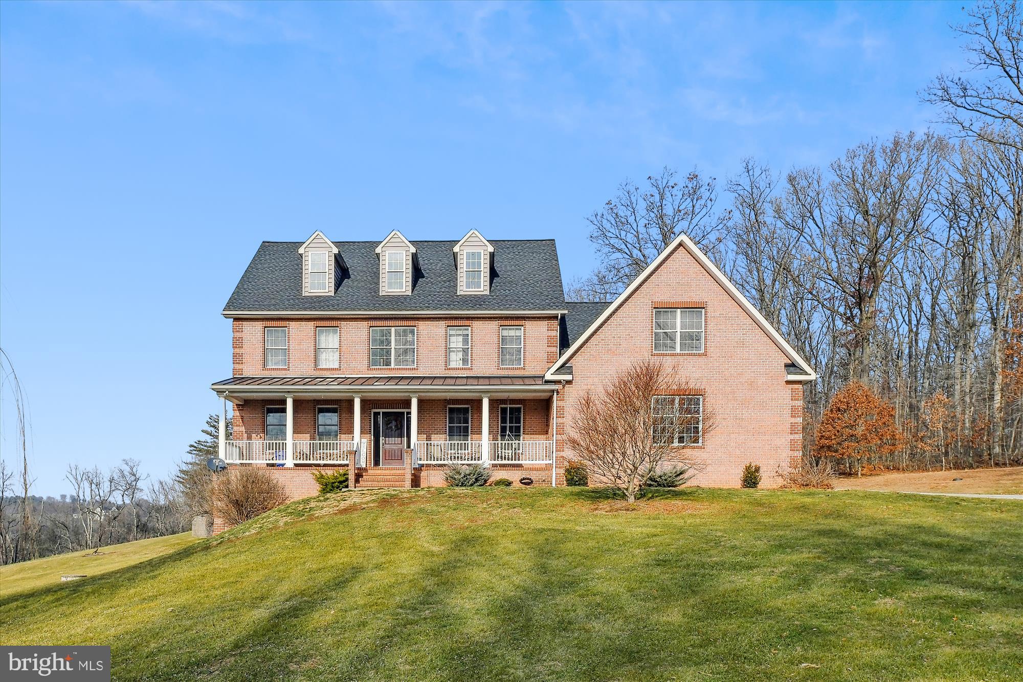 Welcome to a peaceful paradise located in the coveted Hereford Zone School District! This 47 acre property is a perfect place to raise a family, walk the wooded trails, or even go hunting. Included is a 7,161 square foot custom built brick home with 6 bedrooms and 5 and a half baths. From the oversized 3 car garage enter a spacious mudroom that has laundry hook up. The open concept dining, kitchen and family room is complete with custom hickory cabinets and beautiful granite countertops. A wood burning main level fireplace keeps the whole home cozy. The partially finished basement has a walk out slider and a pellet stove along with a bedroom, bathroom, and full handicap accessible shower. In each generous upstairs bedroom there is a full bath and walk-in closets. In addition to the bedrooms there is a full laundry room with storage and a sink. The unfinished third floor with plumbing hook up has spectacular views and could be turned into a small apartment, movie room, bedroom, or rec room. Central vac, geothermal heating and many more amenities.
Outside there is a heated inground salt water pool and deck that overlooks the breathtaking sunsets. A half acre field is fenced in with a small shelter with electric and water for your favorite pets. There is also a 26x36 detached garage complete with water and electric as well as stairs leading to second floor storage. Don't forget to take a walk to dip your toes or catch a fish in Deer Creek!
