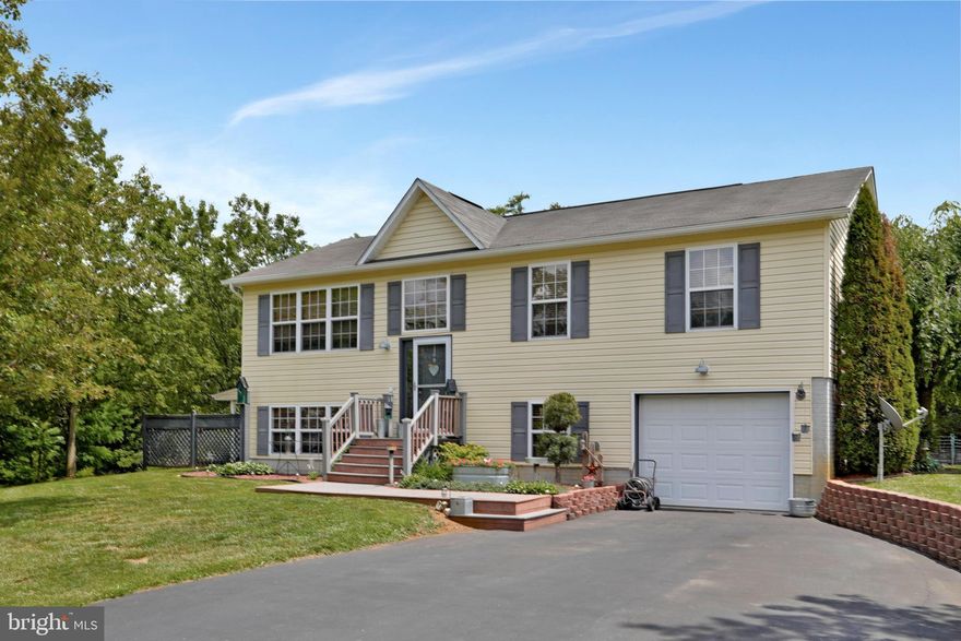 Beautifully maintained split foyer home. Open concept living, kitchen, and dining with pergo floors.  Access to rear deck overlooking the back yard where you will find an above ground pool, pool shed, and a storage shed.  3 bedrooms with carpet and 2 full baths on the upper level.  Primary bedroom features a walk-in closet and en-suite bathroom with granite counters and walk-in tiled shower.  Lower level features a large family room with electric fireplace and sliding door to the covered patio, as well as bedroom #4, an office, third full bathroom, & laundry room.  Paved driveway leads to the basement garage.  Outside is just as nice as the inside, with beautiful landscaping and stone retaining walls.  Located in a well-established neighborhood minutes to I-81.  This home will go fast - act now to schedule a tour!