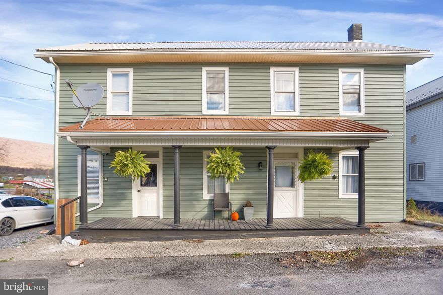 This beautifully remodeled 3-bedroom, 2.5-bathroom home offers 1,965 sq ft of stylish living space with a spacious backyard. The thoughtfully updated floor plan includes a convenient first-floor bedroom, bath, and laundry. The upgraded kitchen features stainless steel appliances and a breakfast bar. A double sink, walk-in shower and jacuzzi tub are part of the upstairs bathroom renovations. Fresh paint and new flooring throughout complement the modern design, while mini-split systems on both floors ensure year-round comfort. Step outside onto the large back deck, which leads to a covered outdoor pavilion with a bar and fireplace—perfect for entertaining guests. This .28 acre property also includes a one-car garage with a workshop, off-street parking, and a well-maintained yard which is bordered by a small stream. With new roofs, windows, and doors, this home offers an affordable retreat where you can unwind and enjoy your own private haven.