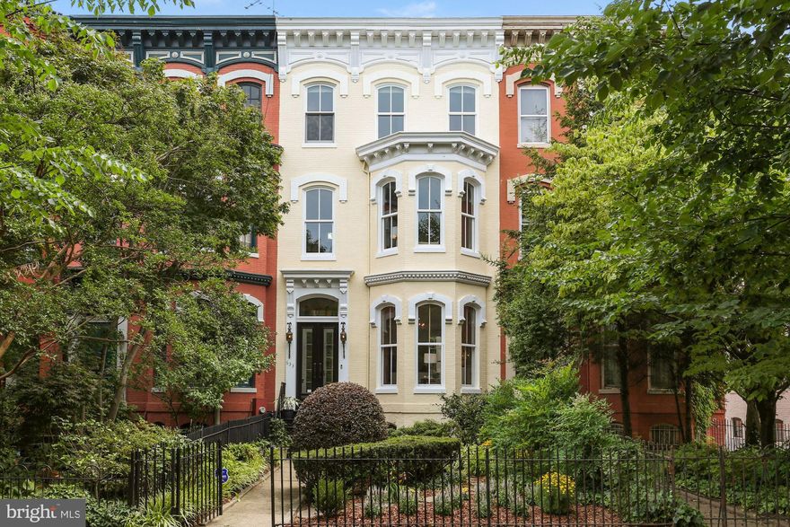 OPEN SATURDAY AND SUNDAY, JULY 2 AND 3, 11:30-2.  WHAT A TREAT AND DELIGHT!  WELCOME to 633 East Capitol Street, SE, truly one of the grandest and most elegant homes on the boulevard! Built ca. 1880 and beautifully and lovingly updated, it retains  the extraordinary touches of its origin: soaring 12 ' ceilings, stunning crown  moldings and ornamental plaster-work, gorgeous matching marble fireplace mantels, almost floor to ceiling windows, warm heart of pine floors to name a few.   Although designed for extravagant elegant entertaining, it's interior is flexible enough to welcome the intimacy of two or to accommodate a birthday party for 2 year olds.  Surrounded by deep front and rear landscaped  gardens, your privacy is assured and your green thumb made happy. This gorgeous 3 story brick bay Victorian and English basement, with six bedrooms 4 baths lives so easily---double living room, formal separate dining room, delightful eat-in chef's kitchen, owner's bedroom suite with fireplace and a separate generous sitting room/library room/bedroom, a second large bedroom with hall bath on the 2nd level and 3 bedrooms one bath at the top.  The lower level is quite flexible.  presently a gym, formerly a music room and prior a bedroom...a shower bath, a huge laundry room and storage room with access to the rear garden from this level.  The kitchen's breakfast room opens to and overlooks the  lush patio/garden...perfect for large scale entertaining and/or a cup of tea in the morning or spot of merlot at the end of the day... At the very rear of the property is a huge two-car GARAGE with extra storage---that rare commodity everyone seeks and is so seldom found!  The garage opens onto the expansive A Street/East Capitol Street brick alley...where children play hoops and perhaps, practice a few soccer moves.  633 East Capitol Street is quite special---a rare find and one of the best!