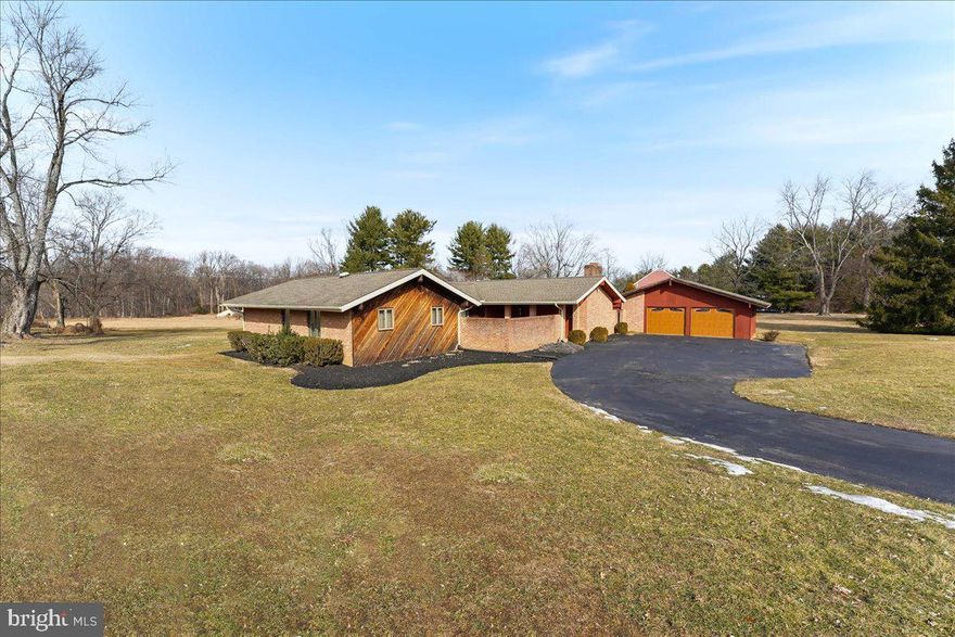 Stunning property in Hamorton Woods with a beautiful mix of modern meets retro! This original owner has done some beautiful custom updates and has maintained the property so nicely. This is a 2-3 bedroom ranch with a foyer, sunny living room with vaulted ceilings and sliders on both sides, a beautiful dining room overlooking the open yard, a modern updated kitchen, family room with a full stone wall surrounding the fireplace, a main floor laundry/mud room,  with a half bath, an oversized detached two car garage, a courtyard, and a full unfinished basement.
The kitchen features brand new appliances! Many windows have been replaced and some rooms freshly painted. The smallest of the 3 bedrooms is currently being used as an office, with plumbing installed underneath so that a lucky new owner can easily make it a full bathroom if desired. 
The fully renovated family room features a stunning stained glass window, brand new paint and carpet, recessed lighting, vaulted ceiling, and just picture shelves/book shelves in the lit openings on each side of the fireplace! Just imagine the possibilities! The full jack and jill bathroom and some of the bedrooms have such a fun retro vibe!
The location is unbeatable! So convenient to route 1, downtown Kennett Square, tons of shops and restaurants, Longwood Gardens, and Wilmington DE, yet the home is situated on over an acre of land, in a beautiful open, yet private setting. You'll love watching the visiting family of deer at sunset!