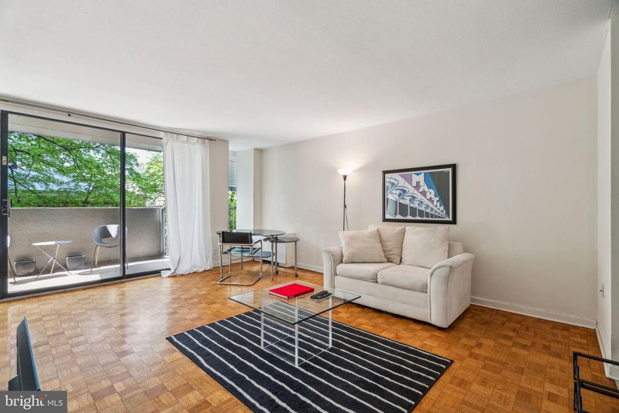 Sun-soaked junior one bedroom boasting a large private balcony at The Dorchester on Rittenhouse Square! Enter the home into a foyer with excellent closet space that leads to an open great room gleaming with natural light that provides ample space for a living and dining area. Accessible via the great room is a private balcony with treetop views, serving as the perfect spot to enjoy your morning cup of coffee. Adjacent, there is a separate and updated kitchen with modern cabinetry, black countertops, stainless steel appliances, and a breakfast bar. The bedroom enjoys a large walk-in closet and use of a nearby full hall bathroom with a tub shower. There are parquet wood floors throughout. Residents of The Dorchester enjoy a 24-hour doorman, state-of-the-art fitness center, seasonal rooftop pool club and valet parking in the building's underground garage available for an additional fee.