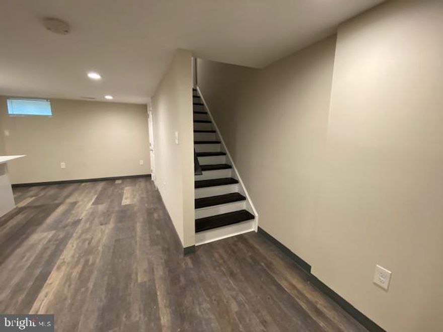 This is a fully renovated two-level apartment featuring beautiful modern finishes throughout. This lovely apartment offers 3 bedrooms and 2 full bathrooms. 1 bedroom is  on the main level. The other 3 bedrooms are upstairs as well as the laundry room for ultra convenience . There is an in-unit washer and dryer, and a beautiful, spacious deck out back. Move-in ready and waiting for you!