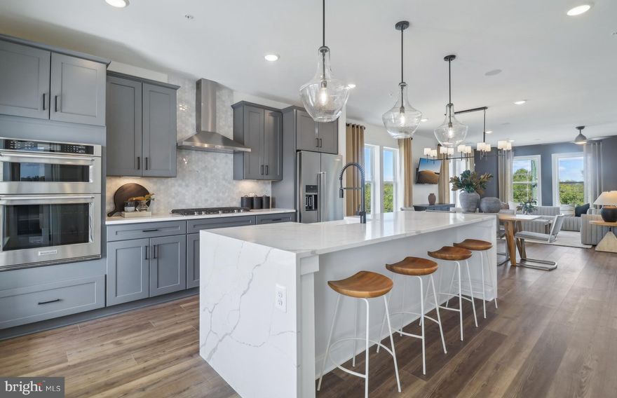 The Sydney is the largest 2-level condo at Farmstead District, offering the space of a townhome with an included terrace off the kitchen and an optional fireplace. It features 3 spacious bedrooms upstairs, including a large owner’s suite with 2 walk-in closets. The first level includes a rear kitchen with a large walk-in pantry, opening to the café and large gathering space. The den can be used as an office. The Sydney at Farmstead District offers abundant natural light with many windows.