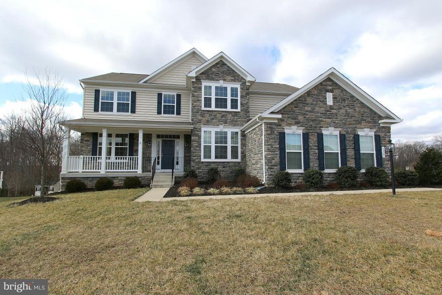 Huge kit island with granite & stainless steel app. Open Fam Rm with stone fireplace. Bright Sunroom off Kit with door that leads to back deck. Complete privacy out back. Upstairs has unique homework/desk station. Large MBR wth sitting rm. Basement complete with BR and full BA- Au-pair or Inlaw suite. 3 car side garage!