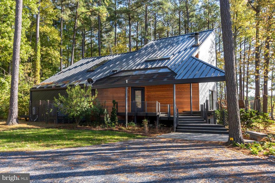 Welcome to Sunnyside Up. Stunning waterfront property with four bedroom main house and detached guest house designed by Architect Mark Beck as his primary residence in 1983. Capturing natural light , serene water views and offering  thoughtfully designed exciting spaces with sight lines to connect. Numerous porches and balconies also bring the outside in and the design offers both large gathering spaces and areas for private retreat. The separate guest house with additionally exciting architecture is set back a bit from main house and commanding an equal exceptional water view. Guest house includes an attached garage. The site is lovely ,overlooking the waters of Irish Creek with a west, south west exposure and good water dockage, about 4 +/-feet. Recent improvements to both main house and guest house include hardwood flooring, handsome, quality, metal and membrane roofing, encapsulated crawlspaces, thoroughly painted, custom landscaping and new boat lifts. The recent exterior roofing and siding improvements won the 2023 Annapolis What's Up Design/Home award! There is an existing boat launch and room for a pool. Ideally located just outside village of Royal Oak, between Easton and Saint Michaels and close to Oxford Bellevue Ferry.