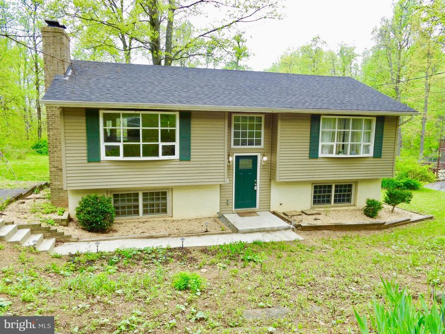 Mountain Living without the Gravel Roads!  Wooded Setting Located on Paved, State Maintained Road provides easy access to I-66, Appalachian Trail, Wineries and State Game Preserve.  The open floor plan features brick fireplace, flex room can easily be family room or 4th bedroom, built-in shelving, crown & panel molding, main level bath with walk-in shower, lower level bath with whirlpool tub.
