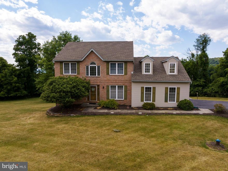 Welcome home to 28 Meadow Ridge Drive, nestled in the desirable Muhlenburg Area School district. This beautiful property, on a culdesac and situated on over an acre of land, offers a spacious and inviting living space with five bedrooms and three and a half bathrooms, including an in-law suite. Upon entering the main level, you'll be greeted by a welcoming foyer. The office, featuring large windows, provides a bright and productive workspace. The living room and sitting room boast hardwood flooring throughout, creating a warm and elegant atmosphere. The kitchen is equipped with well-maintained wooden cabinets for ample storage and a cozy breakfast area. The large formal dining room, which leads to a relaxing sunroom, is perfect for entertaining guests. Upstairs, the primary bedroom features a walk-in closet and an en-suite bathroom. The other three bedrooms are generously sized, each with its own closet and ceiling fan, and they share a well-appointed bathroom. The lower level houses the in-law quarters, complete with a separate outside entrance, a comfortable living area, its own kitchen, and a bedroom, offering privacy and convenience for extended family or guests. The expansive backyard provides plenty of space for outdoor activities, complemented by a large deck perfect for relaxing or hosting gatherings. Conveniently located near local shopping, dining, and major highways, this home offers both tranquility and accessibility. Schedule your showing today and experience the charm and comfort of 28 Meadow Ridge Drive!