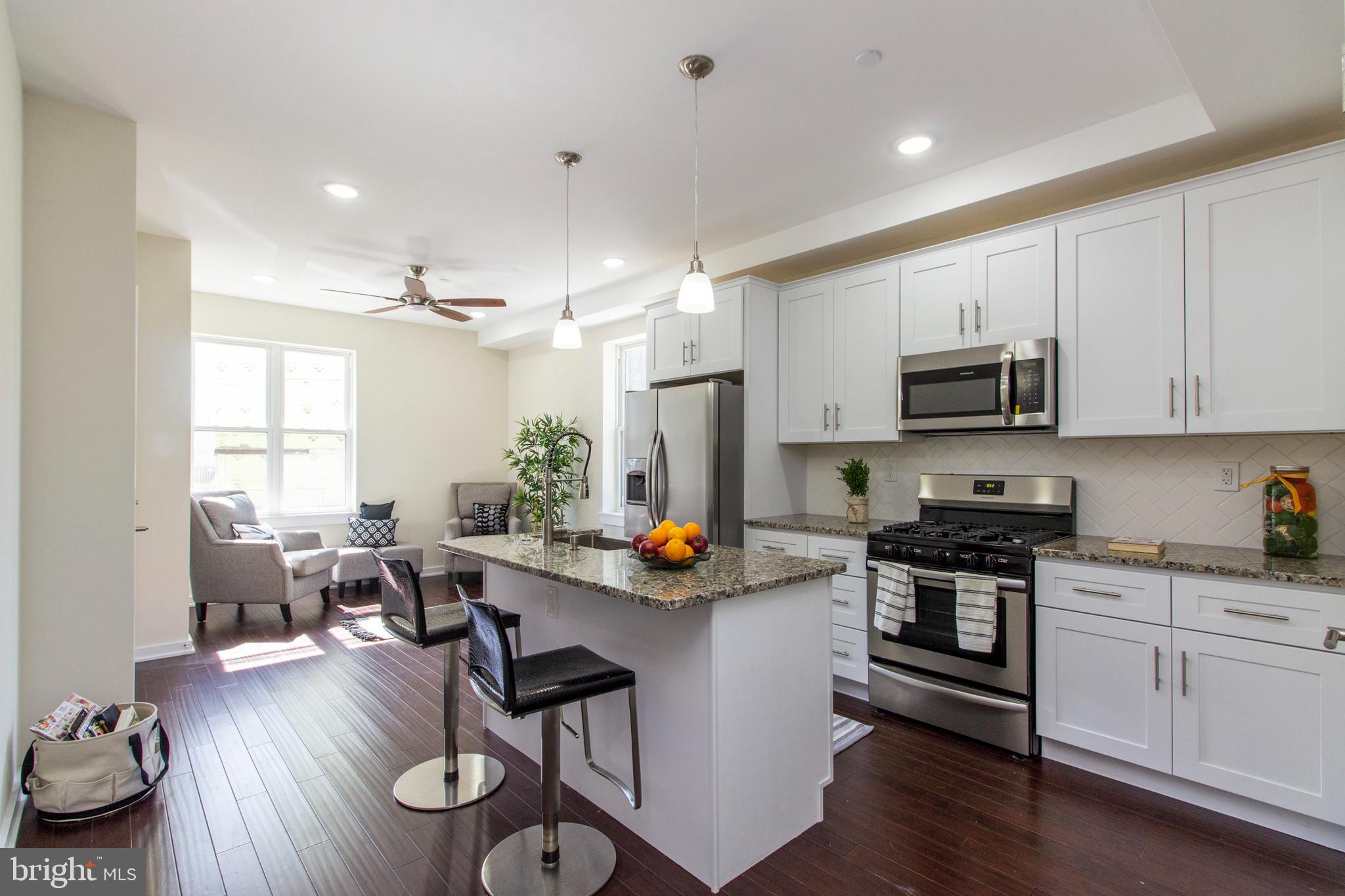 Available for July 1st move in. If you are looking for spacious rooms, a large family room, and private outdoor space this is the unit for you! This 3-bedroom has 3 full bathrooms with high end finishes. The main floor has a bright and sunny living/dining area, gourmet kitchen with white cabinetry, stainless steel appliances, with dishwasher and garbage disposal, and a large center island. The main level is complete with 2 spacious bedrooms and 2 spa-like bathrooms, as well as access to the private fenced-in backyard! Head downstairs, where you'll find a HUGE family room, laundry room, and the third bedroom with a walk-in closet and another full bathroom. This unit features 9-foot ceilings throughout, ceiling fan in family room, hardwood flooring, tile flooring, nest thermostats, high end Electrolux washer and dryer, interactive video intercoms (with ability to buzz open the main door), Verizon Fios, and window shades throughout. Modern bathroom tilework and brushed nickel fixtures add to the premium feel of this large, gem of an apartment. Pets negotiable. First, last, and security deposit due upon signing. July 1st move in.