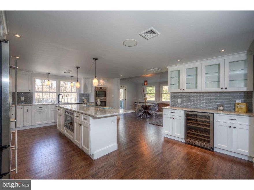 Sitting back from Darby Road on 2 acres this 4,400 sf home has been expanded and completely renovated with the finest finishes.  Enter the foyer to find a formal living room anchored by a brick fireplace and built in shelving.  The adjacent formal dining room has French doors leading out to a slate patio and lovely private yard where wildlife is often viewed.  The state of the art kitchen is perfect for entertaining with its island seating, separate breakfast area, integrated speakers system and wet bar area.  Custom cabinetry with soft close drawers, radiant floor heating, granite countertops, glass tile backsplash and stainless appliances, including a Bosch dishwasher, wine refrigerator, built in microwave, and double Bosch ovens.  The bright adjacent breakfast area could also be used as a den with its original brick wall detailing and a wall of windows to enjoy the expansive rear yard.  The master bedroom suite is HUGE and has a tray ceiling, a custom built out walk in closet and master bath complete with a walk in shower, soaking tub, and double sinks.  3 bedrooms on the second floor with a large laundry room and two more large bedrooms on the third floor with an additional room for an office. Or make one of the bedrooms a playroom, exercise room, homework room- Plenty of space to customize to your lifestyle.  Most windows NEW, NEW HVAC, NEW hot water heater, New overhead lighting throughout, integrated speakers in kitchen and living room, New plumbing, freshly painted, a 2 car garage, plus desirable Coopertown Elementary. An impeccable home in a fabulous setting for under $650!