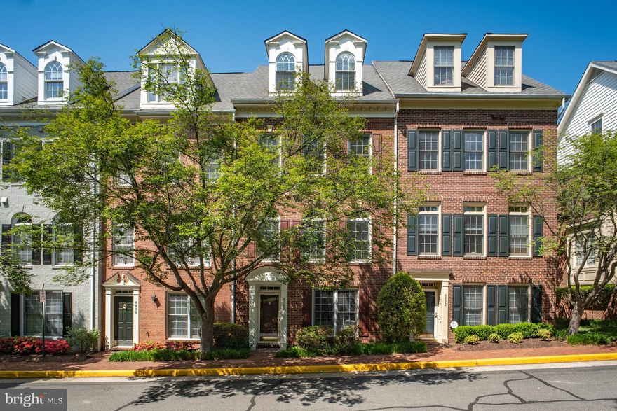 Welcome to 8894 Ashgrove House Lane—an exceptional and rarely available cozy brick 4-level townhome with a 2-car garage, ideally situated in one of Tysons’ most sought-after gated communities, just a short walk to the Metro. This beautifully maintained home offers a bright and inviting interior designed for both comfortable living and effortless entertaining. The main and first floors feature rich wood flooring throughout, while the upper level boasts brand-new carpeting for added comfort. Large windows on front sides flood the home with natural light, enhancing the spacious, open feel. The main level showcases a gracious living room with refined finishes including crown molding, recessed lighting, and soaring 9+ foot ceilings. A formal dining area flows seamlessly into the updated gourmet eat-in kitchen, complete with granite countertops,  and new stainless steel appliances, perfectly balancing style and functionality. Step outside to enjoy the private deck, ideal for relaxing or entertaining. Upstairs, generously sized bedrooms each feature their own private bathrooms, offering comfort and privacy for family and guests alike. The tranquil primary suite impresses with a vaulted ceiling, spacious walk-in closet, and a en-suite bath with dual vanities, soaking tub, separate shower.. A convenient laundry area is located on the bedroom level. The entry level lower level provides versatile living space , perfect for a office , recreation room, home gym,  another bedroom or media lounge tailored to your needs.
Parking is a breeze with a 2-car garage, plus additional permits for both an owner and a guest space. The community backs to a serene wooded reserve with trails, offering a peaceful natural setting. Residents enjoy access to amenities including a pool, fitness center, and more.
Located just one block from the Metro and moments to Tysons West shops, restaurants, grocery stores, and a state-of-the-art fitness club, this home is truly a commuter’s dream with easy access to the Dulles Toll Road, I-495, Route 7, and I-66. Zoned for top-rated schools in the Marshall Pyramid and close to everything Tysons has to offer, this is a rare opportunity to own a stunning home in an unbeatable location.