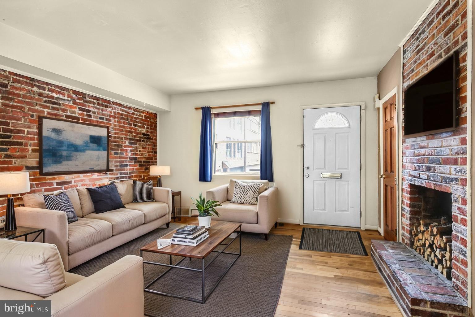 Welcome to 1905 Rodman St! This fantastic 2 bedroom / 1 bathroom single family home is located in the desirable Rittenhouse Square neighborhood. Featuring hardwood floors, exposed brick walls, in-unit laundry, and a private deck, this spacious home is sure to impress! You enter into the living room with exposed brick walls and a working wood-burning fireplace at its centerpiece. There's a large window at the front and built-in shelving for added convenience. Head back to the dining area and then to the kitchen at the back, complete with granite countertops, red tile backsplash, and ample storage space. Continue on the 2nd Floor to view a hall closet and your full bathroom with a lighted vanity and a lovely tiled bathtub / shower combo. The 1st bedroom offers Southern exposure for abundant sunlight. There's a wonderful wooden deck off the hallway - perfect for entertaining in the warmer months! Upstairs on the 3rd Floor is your primary suite boasting a full wall of built-in closets. A Juliet balcony overlooks the deck below. There is a full-sized washer & dryer in the basement, plus a utility sink and storage space for added convenience. Central air ensures comfort all year long - call today! About The Neighborhood: Nestled in Rittenhouse, this is an ideal Center City location walking distance to anything you would need! Close to some of the city's best restaurants, cafes, shopping, grocery and entertainment options. Just a few blocks from Rittenhouse Square, South Street, and the Marian Anderson Recreation Center. Accessible to public transportation SEPTA bus routes for an easy commute throughout the city. Check out neighborhood favorites like Southgate, Barclay Prime, Monk's Cafe, Parc, Founding Father's, Tio Flores, and tons more!