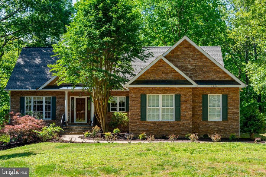 Set on scenic, park waterfront overlooking the lake, this home offers a peaceful retreat with the convenience of immediate lake access. Just a short walk from the backyard, a private community dock and swimming area on main water allow you to keep a boat nearby and enjoy spontaneous afternoons on the lake—whether boating, swimming, or simply soaking in the views.

Quaint from the curb yet surprisingly expansive inside, this custom rambler showcases timeless stone and vinyl siding and an interior filled with architectural detail and thoughtful craftsmanship. Cathedral ceilings create an open, airy feel throughout the home, complemented by hardwood flooring on the main level and LVP flooring in the walk-out lower level. Floor-to-ceiling windows in the living room, sunroom, and lower-level gathering spaces flood the home with natural light while framing peaceful lake views.

The kitchen is designed for both entertaining and everyday living, featuring granite countertops, custom cabinetry with distinctive accent details including a built-in wine rack, a center island, double ovens, and a dedicated desk or work area. It flows effortlessly into the main living spaces and outdoor entertaining areas, making it easy to host or relax.

The main-level primary suite offers a private retreat with a spa-like bath and direct access to a screened-in porch overlooking the water—perfect for morning coffee or evening unwinding. Multiple outdoor living spaces, including a rear deck and screened porches on both levels, invite you to enjoy lake breezes and sunset views year-round. An oversized two-car garage provides ample space for vehicles, storage, and all your lake essentials. A dual heating system with gas and electric adds efficiency, flexibility, and year-round comfort.

The fully finished walk-out lower level adds exceptional flexibility and opens directly to the waterfront. Designed for entertaining and extended stays, it currently accommodates a recreation room, additional dining area, pool table and office. Two lower-level bedrooms feature private exterior access, enhancing privacy for guests. Custom, hand-painted Italian Tuscany-inspired murals and arched walkways create a one-of-a-kind, warm ambiance—an artistic touch rarely found in homes at Lake Anna. An additional unfinished area offers generous storage or future customization.

With over 3,800 finished square feet, main-lake views, walkable access to a private community dock and swimming area, and spaces designed for both relaxed living and entertaining, this home delivers an exceptional Lake Anna lifestyle—comfortable, elegant, and full of surprises.

The sought-after Wyndemere subdivision offers exceptional amenities, including a private boat ramp, three community boat dock areas, tennis courts, a basketball/pickleball court, picnic areas, and common spaces at each waterfront location. Residents also enjoy a welcoming community atmosphere with neighborhood events and gatherings—making this the perfect year-round home or relaxing lake retreat.