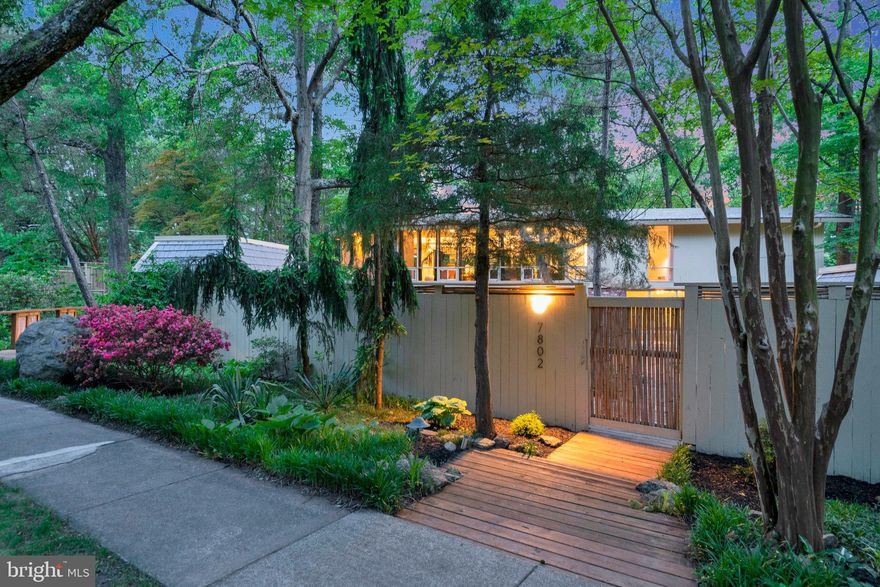 Tucked into a Zen-like oasis, this remarkable Goodman-designed expanded two-level residence has been extensively renovated over the last two years and has the atmosphere of a modern retreat. Enter the home into a welcoming foyer and a wall of windows overlooking the Japanese-inspired grounds. The main floor has been opened up to include a dramatic chef’s kitchen with an oversized kitchen island, Miele and SubZero appliances, and a separate butler's pantry. The openness allows for flexible living and dining spaces and includes a gas fireplace, accordion glass doors, custom lighting, and many special details. The primary bedroom features custom millwork and sconces, and a spectacular primary bathroom featuring a skylit open shower for two, freestanding tub, double vanity, separate WC, and walk-in closet.  A second bedroom is complimented by another full bathroom with premium fixtures. There is also laundry conveniently located in the hallway. Downstairs is an additional living space with a wood-burning fireplace and door to the expansive back decks, plus two more oversized bedrooms, one with a Murphy bed and another full bath with luxe finishes. In addition, there is a second laundry room, storage room, and an additional 600SF of bonus finished living space with a kitchenette, recessed lights, and double doors to the backyard—perfect for a workshop, gym, or in-law suite. This home is designed for indoor/outdoor living with over 3500SF of wrap-around decks and assorted seating areas, all with dramatic vistas throughout. Additional special features are both practical and cosmetic and include exterior ramp and walkway access to the house, curbless showers,  two new HVAC systems, new hot water heater, three custom sheds with new roofs and an irrigation system.