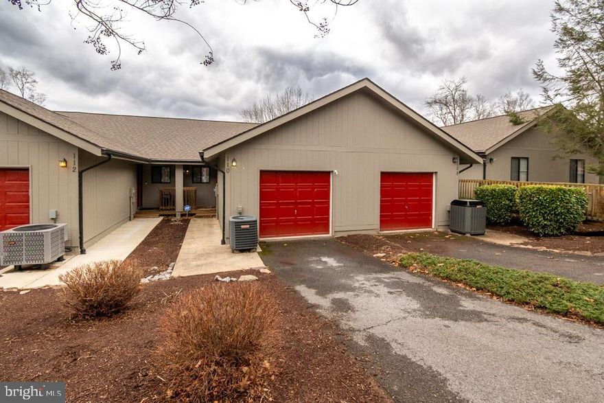 Welcome to 110 Fishhook Ln., a townhome with over 2000 finished SF, 3 bedrooms and 3 baths, and a stunning lakeview setting.  Just 25 minutes from I-81, the location is accessible as a vacation home or rental within 2 hours reach to DC and Baltimore.  This well-maintained home features a large open walk-in level on the top floor, with the kitchen, dining/living area that opens to a deck and beautiful view, a full bath, and attached 1 car garage.  Going down to the middle level, you'll find a large primary suite, with it's own balcony, walk-in closet, and full bathroom with separate tub and shower.  This level also has a well-appointed laundry room and small storage room.  The lower level features a third full bath, a rec or family room, and two additional walk-out bedrooms.  Lawn maintenance and roof replacement are included in the cluster fees, and the Fishhook Cluster also features private tennis courts.  This home does not include an overall amenities membership, but golf at 2 courses, footgolf, and the clubhouse are still accessible on a pay-to-play basis.  There is plenty of hiking nearby as well.