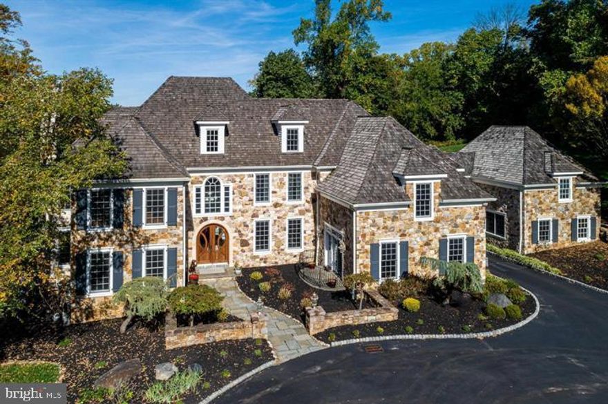 Tucked away at the end of a private lane in Villanova’s most prestigious estate section, 1300 Valley Road offers an INCREDIBLE OPPORTUNITY WITH A $200,000 ARCHITECTURAL DESIGN CREDIT to the buyer with an acceptable offer.  Set on over 4 acres behind elegant gates, this custom-built home showcases the finest in luxury living, prime location, and sophisticated lifestyle.  The property has recently undergone professional landscaping, with privacy trees and perimeter fencing added along the rear, perfect for children or pets to safely enjoy the backyard.

Boasting over 10,000 square feet of exquisitely designed living space, the home features soaring ceilings, high-end finishes, and an ideal first-floor layout perfect for everyday living or hosting grand events. Gorgeous hardwood floors, custom 8-foot solid wood doors, cove lighting, and sleek modern details make this a true masterpiece.  The gourmet kitchen, equipped with top-tier Wolf and Subzero appliances, along with a Butler’s Pantry featuring a built-in Miele espresso machine, extra dishwasher, and ample storage, make this space a chef’s dream.

In addition to the Family Room, Breakfast Room, Living Room, Dining Room, and Office, the main level also offers a versatile Bonus Room, perfect as a media space or guest/in-law suite, complete with a full bath.  A grand staircase leads to the second-floor retreat, highlighted by a luxurious Primary Suite with gas fireplace, dual marble baths, separate His & Her vanities, closets, and water closets. Four additional secondary bedrooms all with ensuite bathrooms complete the second floor. The third level features a large loft with full bathroom and spiral staircase to additional living space.

The guest house provides a completely separate living space with its own living area, full kitchen, two full baths, and private entrance.  Also attached by hallway on the second level for the utmost convenience.

The walk-out lower level is perfect flooded with natural light and includes a kitchenette, Billiards room, open media/game room, gym and a full bathroom. Outside, there is a 3 car oversized garage with room to add more, plus space for a pool, tennis, or sports court. Conveniently located in Lower Merion, this property is just minutes from Conshohocken, the best of Main Line living, top schools, and downtown Philadelphia.